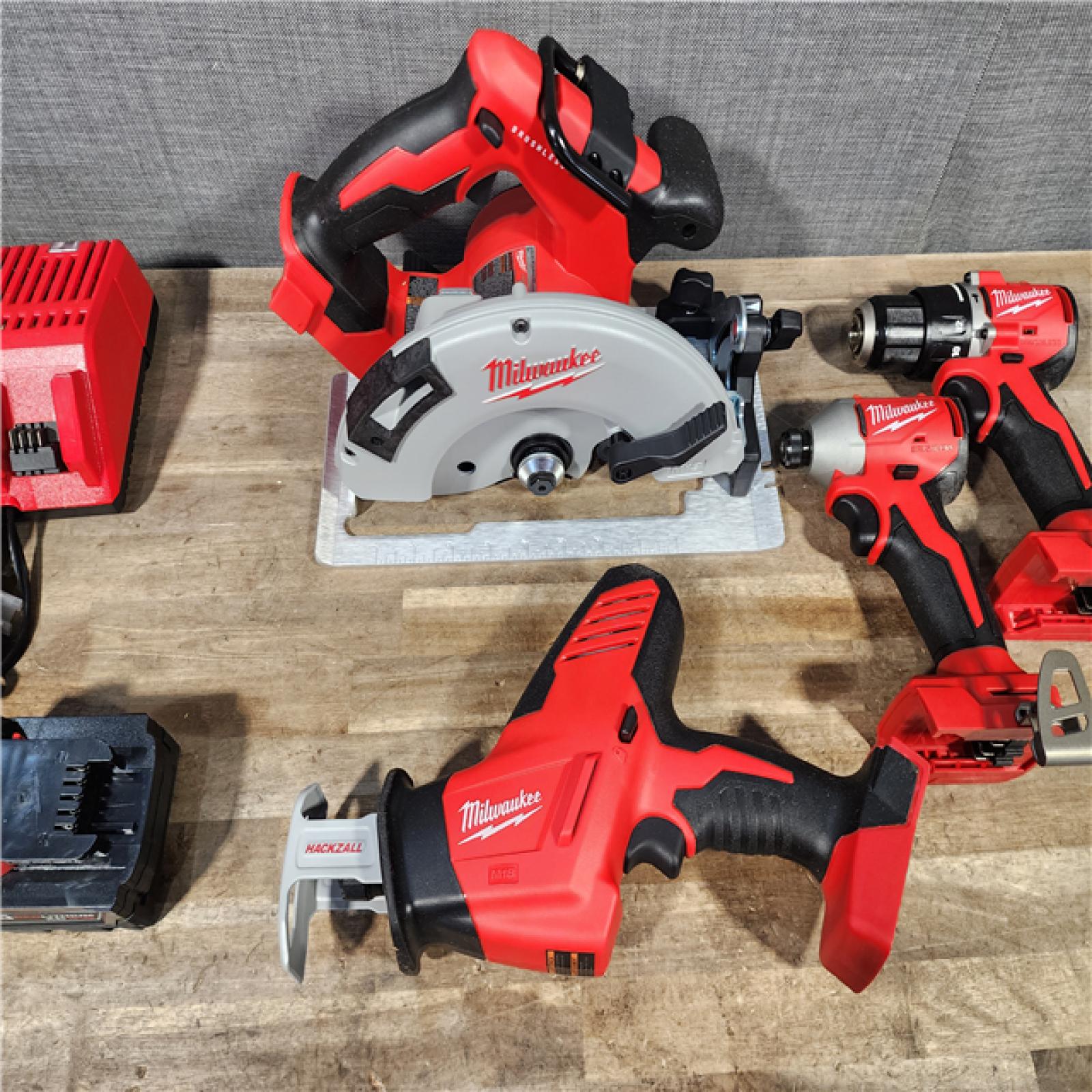 HOUSTON LOCATION - AS-IS Milwaukee M18 18-Volt Lithium-Ion Brushless Cordless Combo Kit (4-Tool) with 2-Batteries  1-Charger and Tool Bag