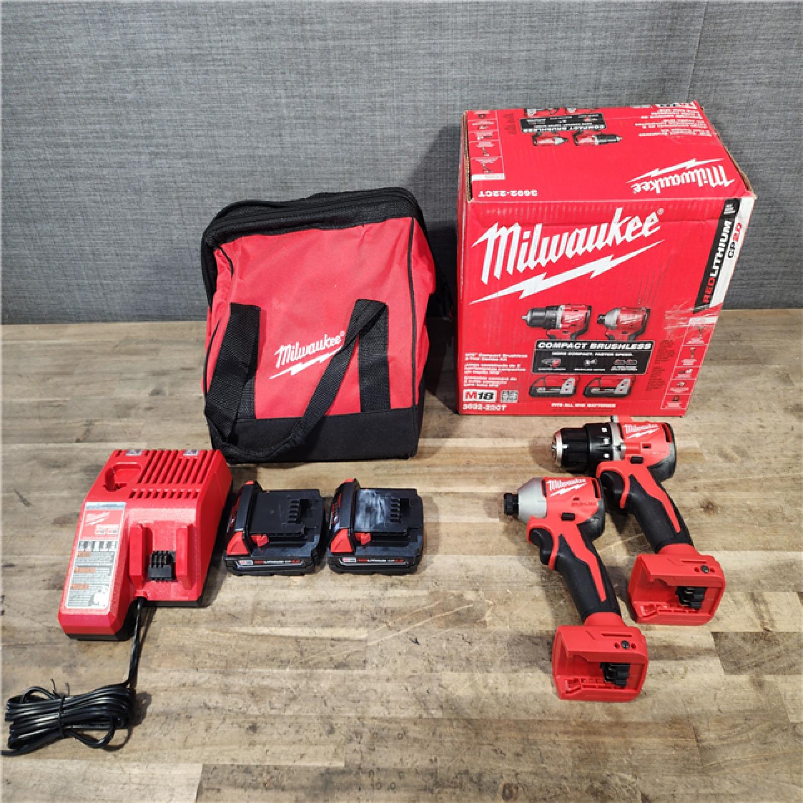 HOUSTON LOCATION - AS-IS Milwaukee M18 18V Lithium-Ion Brushless Cordless Compact Drill/Impact Combo Kit (2-Tool) W/(2) 2.0 Ah Batteries, Charger & Bag