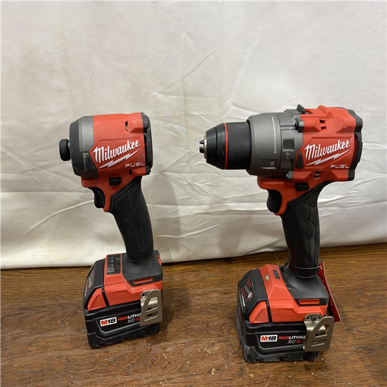 AS-IS MILWAUKEE M18 FUEL 18V Lithium-Ion Brushless Cordless Hammer Drill and Impact Driver Combo Kit (2-Tool) with 2 Batteries