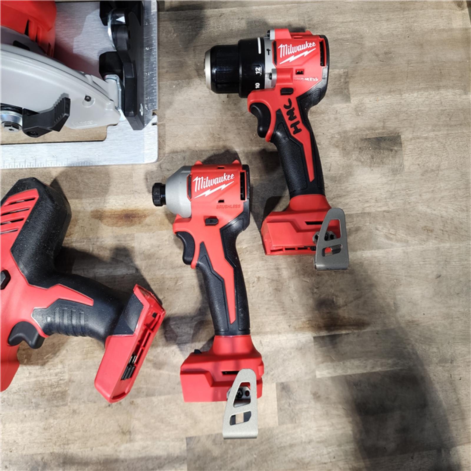 HOUSTON LOCATION - AS-IS Milwaukee M18 18-Volt Lithium-Ion Brushless Cordless Combo Kit (4-Tool) with 2-Batteries  1-Charger and Tool Bag