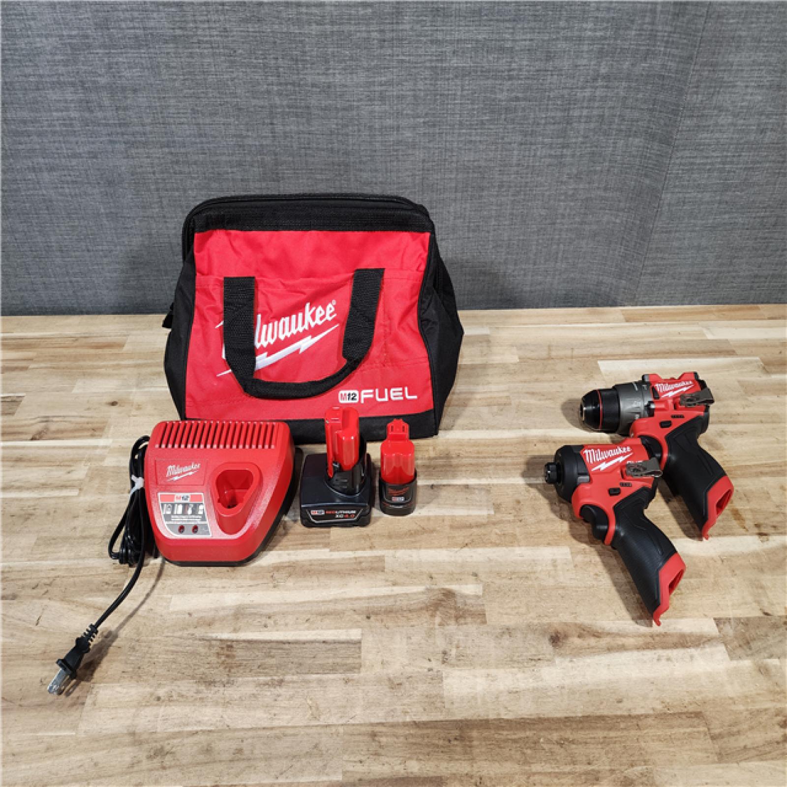 HOUSTON LOCATION - AS-IS Milwaukee  FUEL 12-Volt Lithium-Ion Brushless Cordless Hammer Drill and Impact Driver Combo Kit