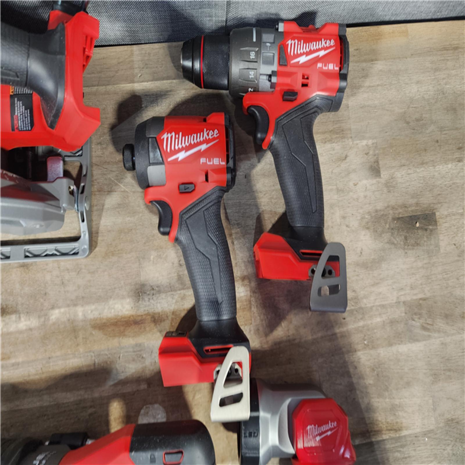 HOUSTON LOCATION - AS-IS M18 FUEL 18V Lithium-Ion Brushless Cordless Combo Kit with Two 5.0 Ah Batteries  1 Charger 1 Tool Bag
