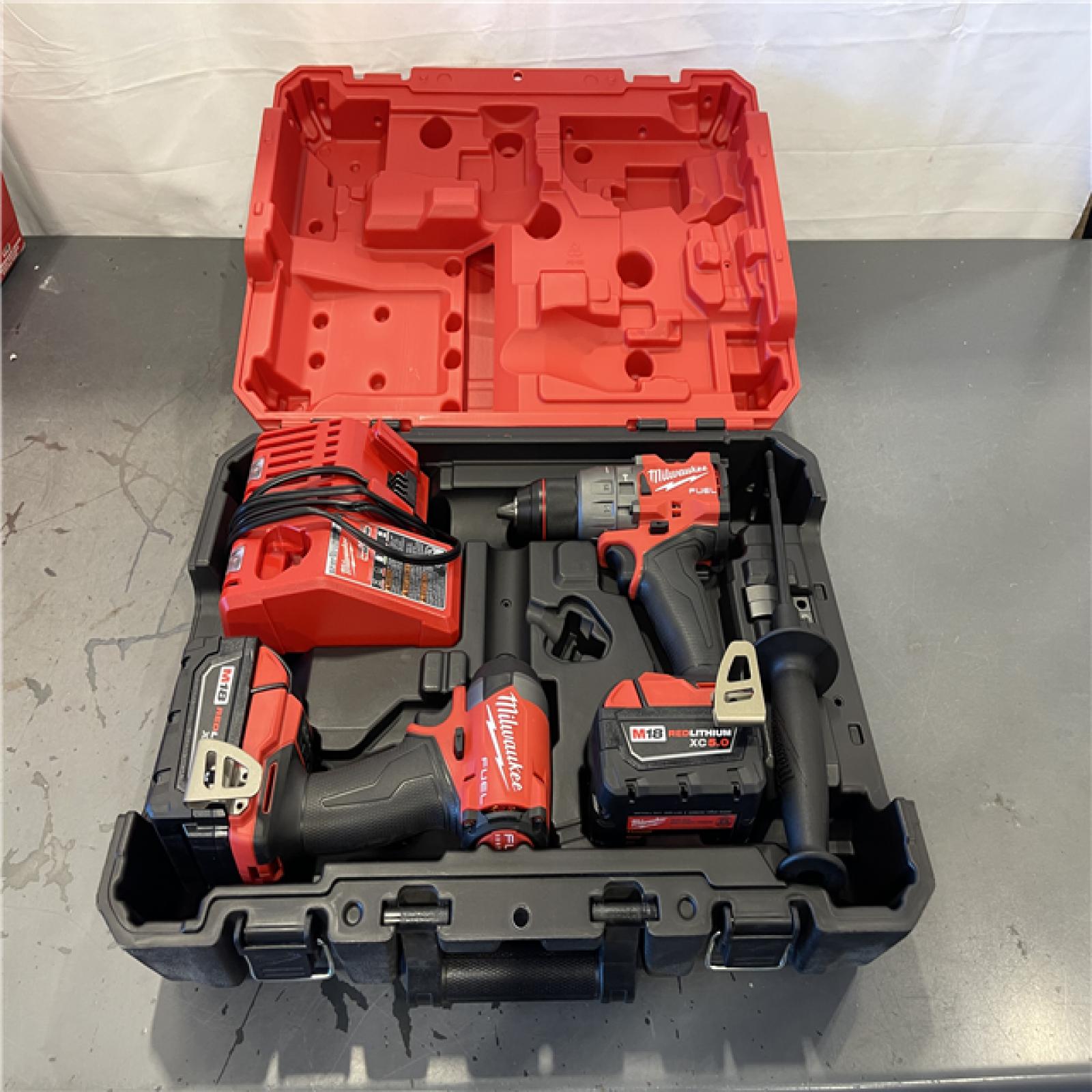 AS-IS - Milwaukee M18 FUEL 18V Lithium-Ion Brushless Cordless Hammer Drill and Impact Driver Combo Kit (2-Tool) with 2 Batteries