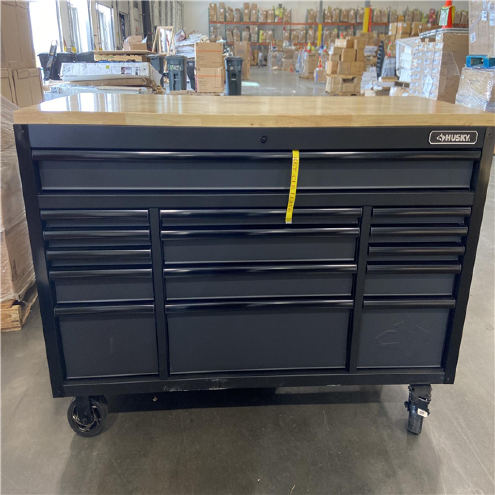 DALLAS LOCATION - Husky 61 in. W x 23 in. D Heavy Duty 15-Drawer Mobile Workbench Tool Chest with Solid Wood Top in Matte Black