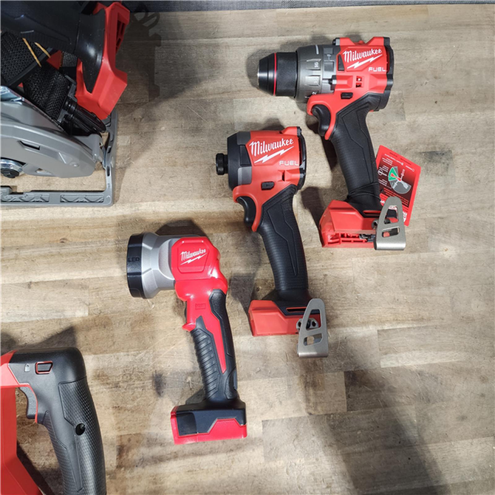 HOUSTON LOCATION - AS-IS (APPEARS LIKE NEW) M18 FUEL 18V Lithium-Ion Brushless Cordless 5-Tool Combo Kit with Two 5.0 Ah Batteries  1 Charger 1 Tool Bag