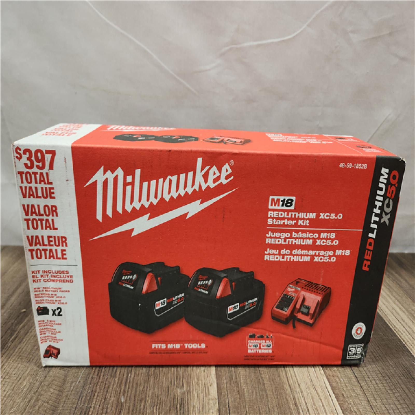 NEW- M18 18-Volt Lithium-Ion XC Starter Kit with Two 5.0Ah Batteries and Charger