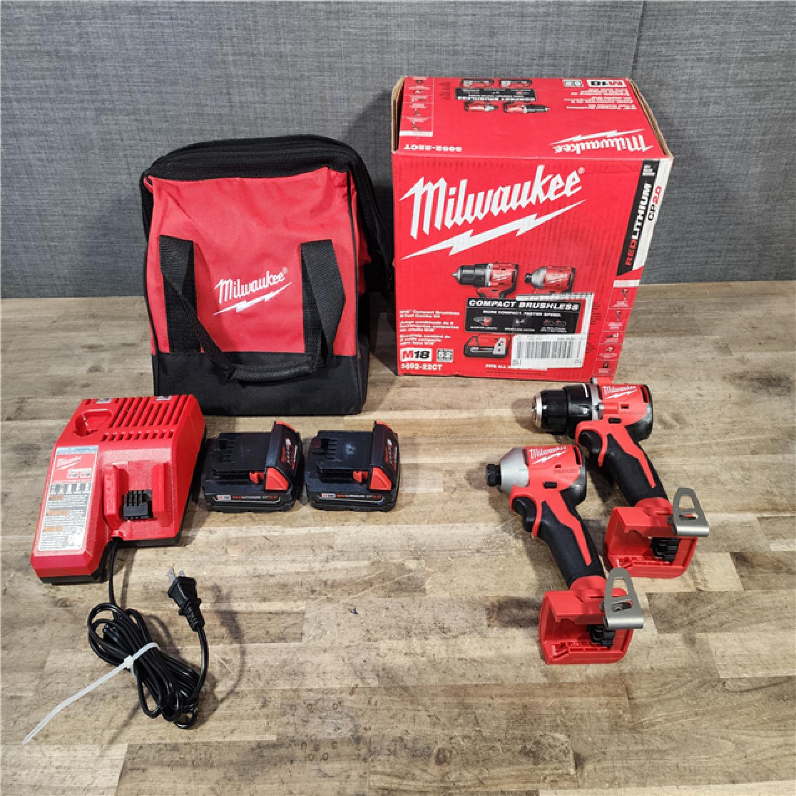 HOUSTON LOCATION - AS-IS Milwaukee M18 18V Lithium-Ion Brushless Cordless Compact Drill/Impact Combo Kit (2-Tool) W/(2) 2.0 Ah Batteries  Charger & Bag