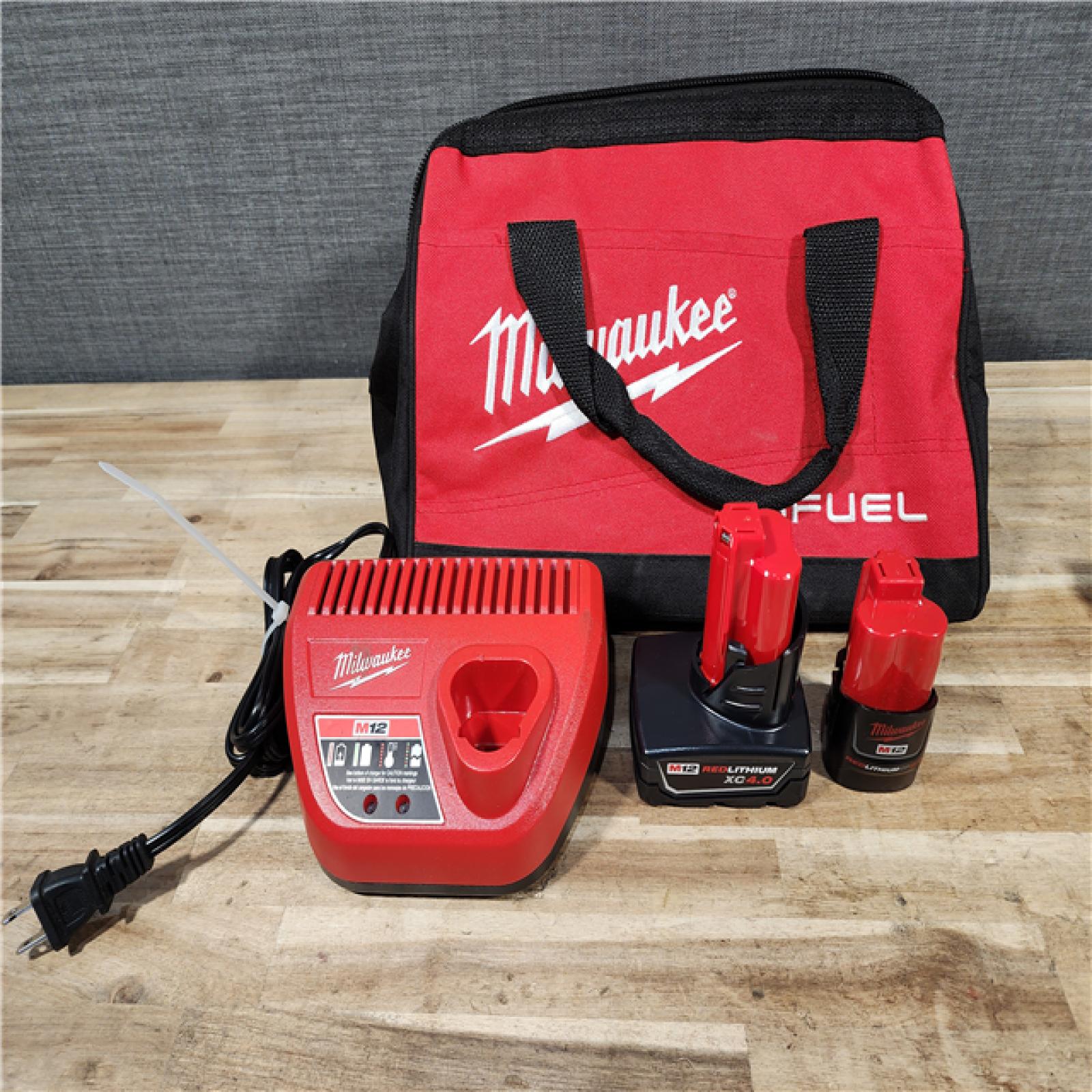 HOUSTON LOCATION - AS-IS Milwaukee FUEL 12-Volt Lithium-Ion Brushless Cordless Hammer Drill and Impact Driver Combo Kit