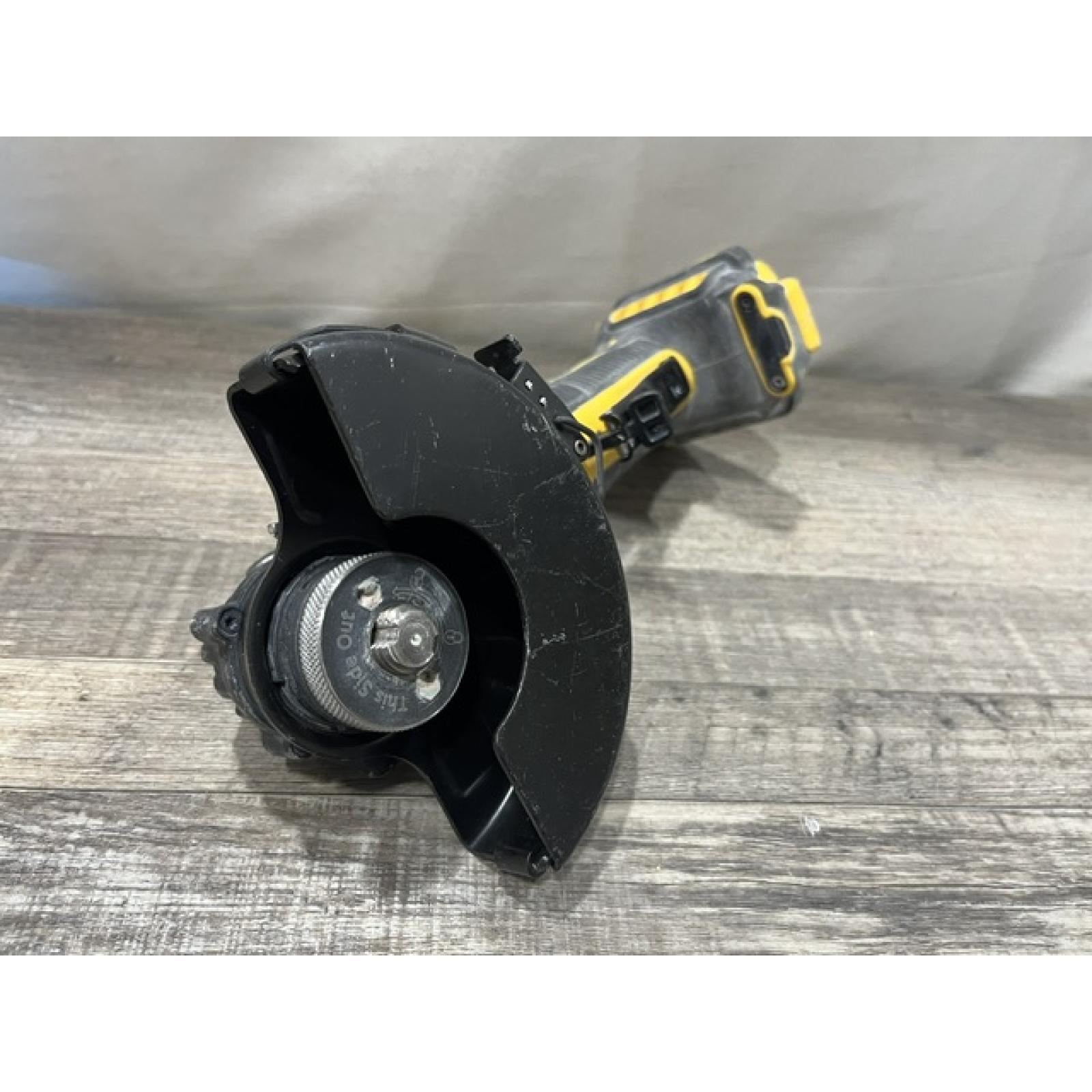 AS-IS DEWALT ATOMIC 20V MAX Cordless 4-1/2 in. Angle Grinder with Paddle Switch (Tool Only)
