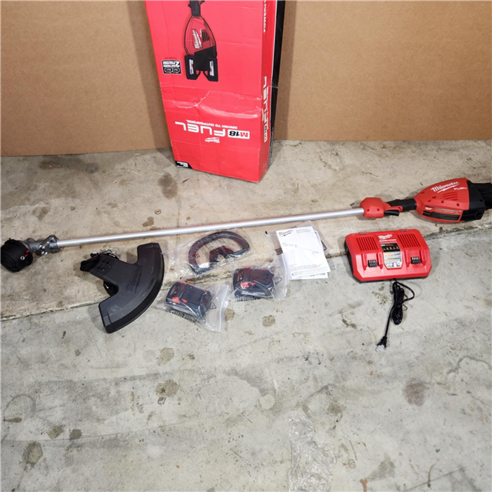 Houston location AS-IS Milwaukee M18 FUEL 18V Brushless Cordless 17 in. Dual Battery Straight Shaft String Trimmer with (2) 8.0 Ah Batteries and Charger