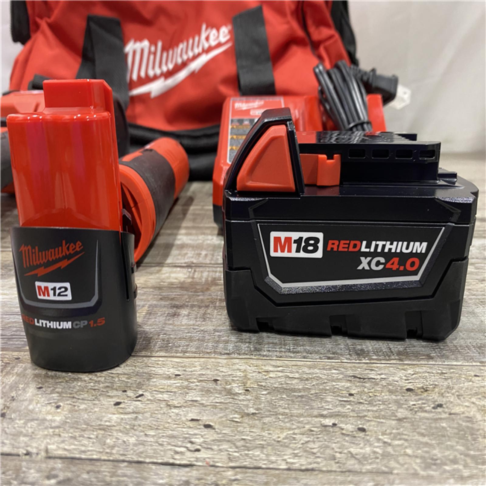 AS-IS Milwaukee 12/18V Lithium-Ion Cordless 3/8 in. Ratchet and 1/2 in. High Torque Impact Wrench with Friction Ring Combo Kit