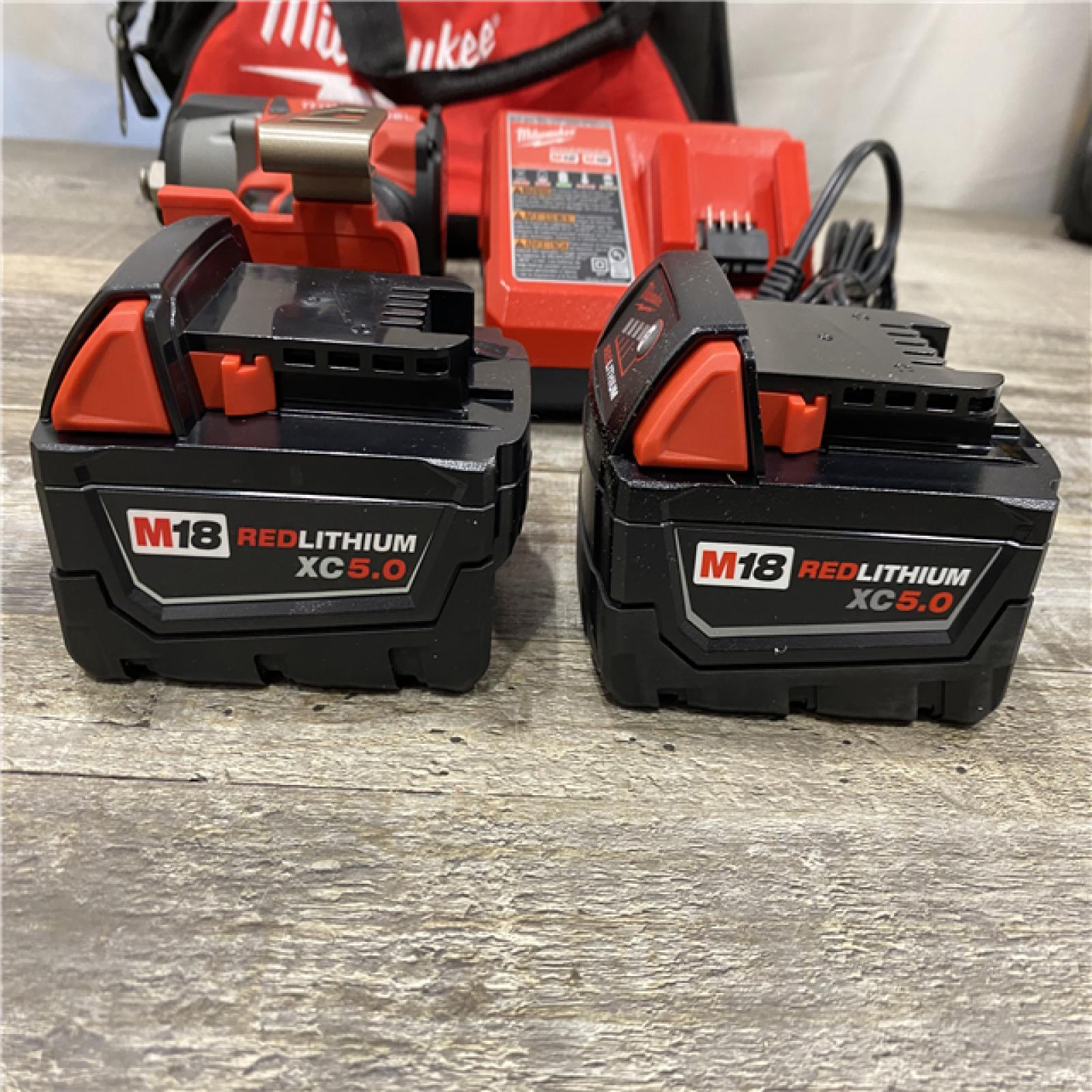 AS-IS Milwaukee FUEL 18V Lithium-Ion Brushless Cordless 1/2 in. Mid-Torque Impact Wrench with Friction Ring Kit