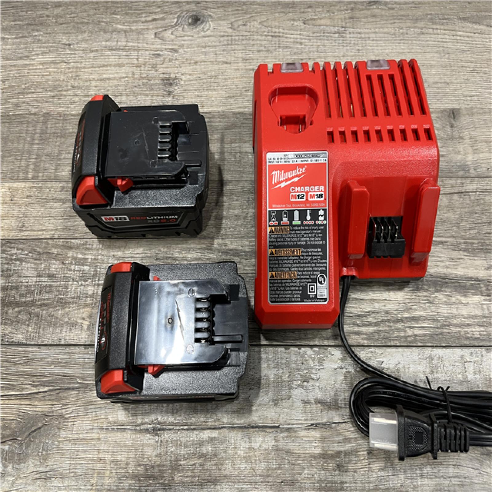 AS-IS Milwaukee 18-Volt Lithium-Ion XC Starter Kit with (2) 5.0Ah Batteries and Charger