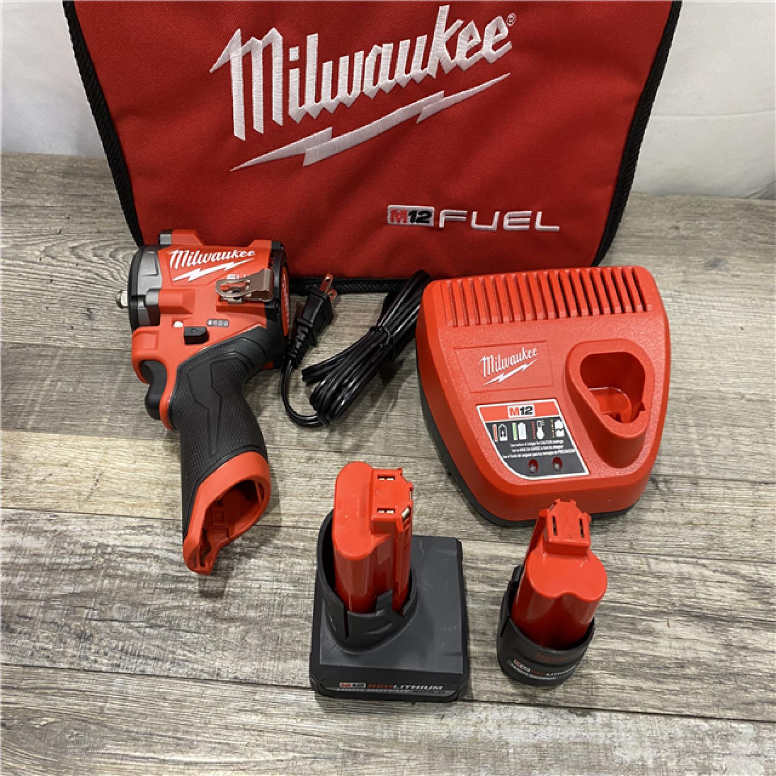 AS-IS Milwaukee FUEL 12V Li-Ion Brushless Cordless Stubby 3/8 in. Impact Wrench Kit