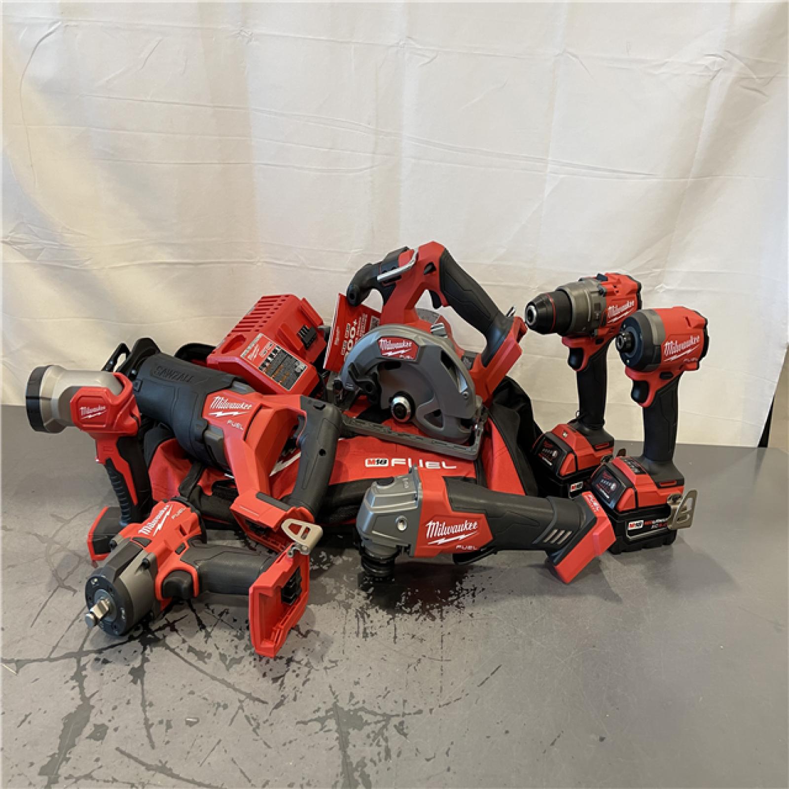 AS-IS-  Milwaukee M18 FUEL 18V Lithium-Ion Brushless Cordless Combo Kit with Two 5.0 Ah Batteries  1 Charger  2 Tool Bags (7-Tool)