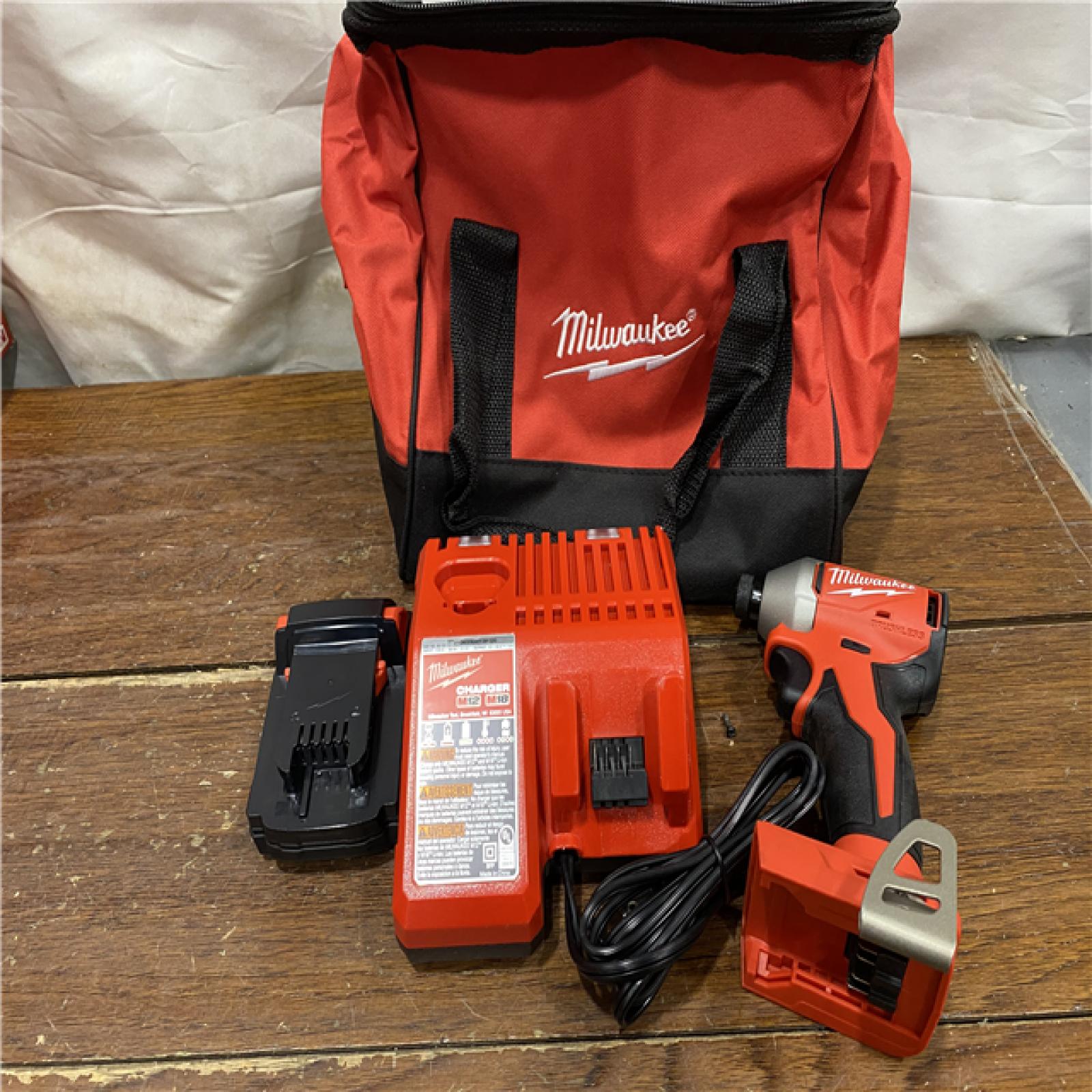 AS-IS Milwaukee M18 Compact Brushless 1/4  Hex Impact Driver Kit