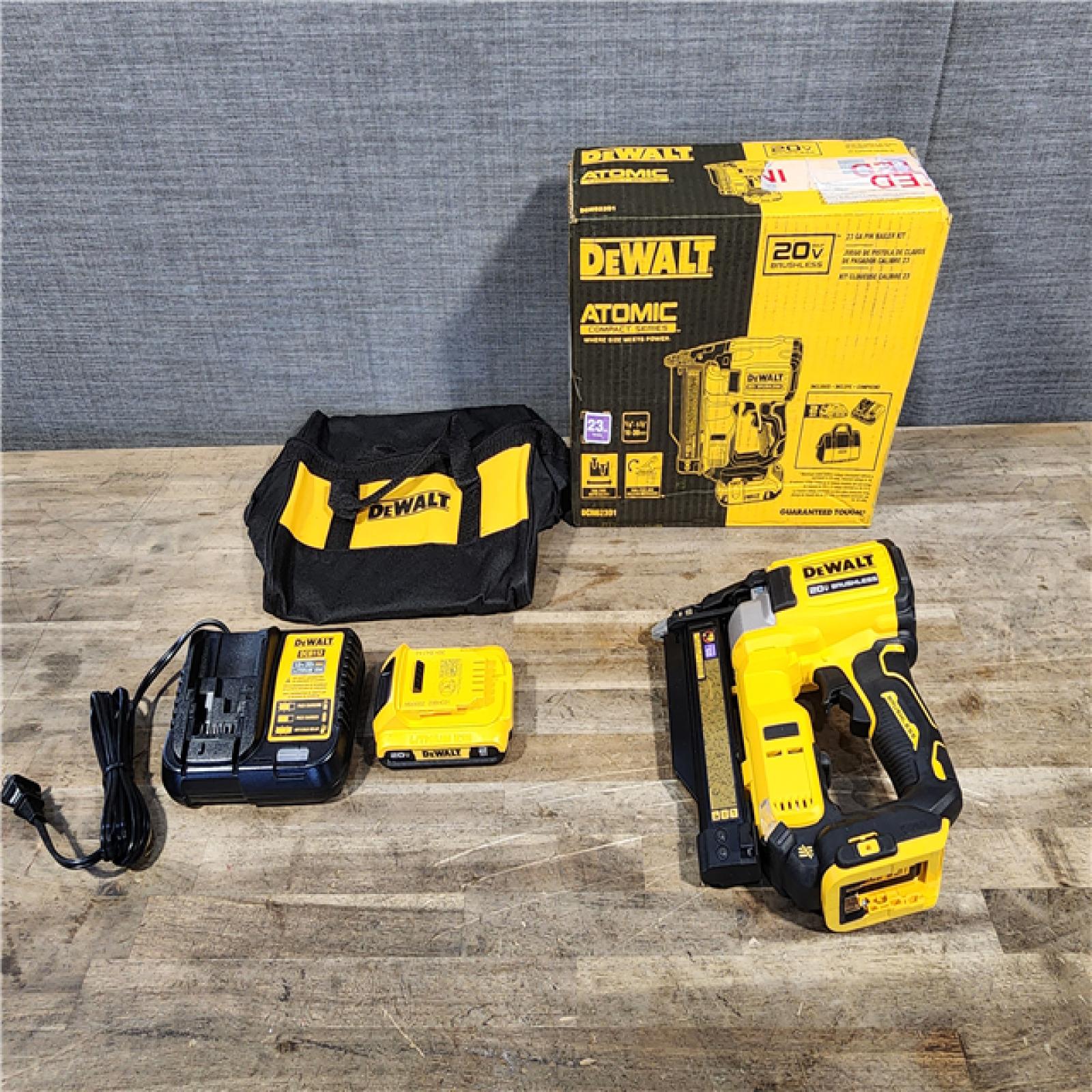 HOUSTON LOCATION - AS-IS (APPEARS LIKE NEW) DEWALT ATOMIC 20V MAX Lithium Ion Cordless 23 Gauge Pin Nailer Kit with 2.0Ah Battery and Charger