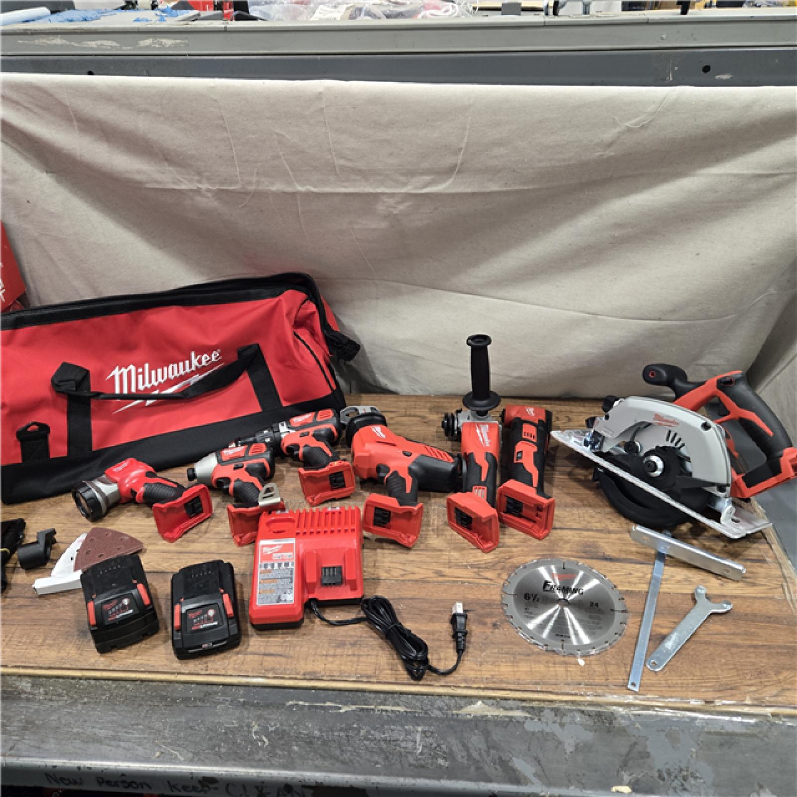 AS-IS Milwaukee M18 18-Volt Lithium-Ion Cordless Combo Kit 7-Tool with 2-Batteries, Charger and Tool Bag
