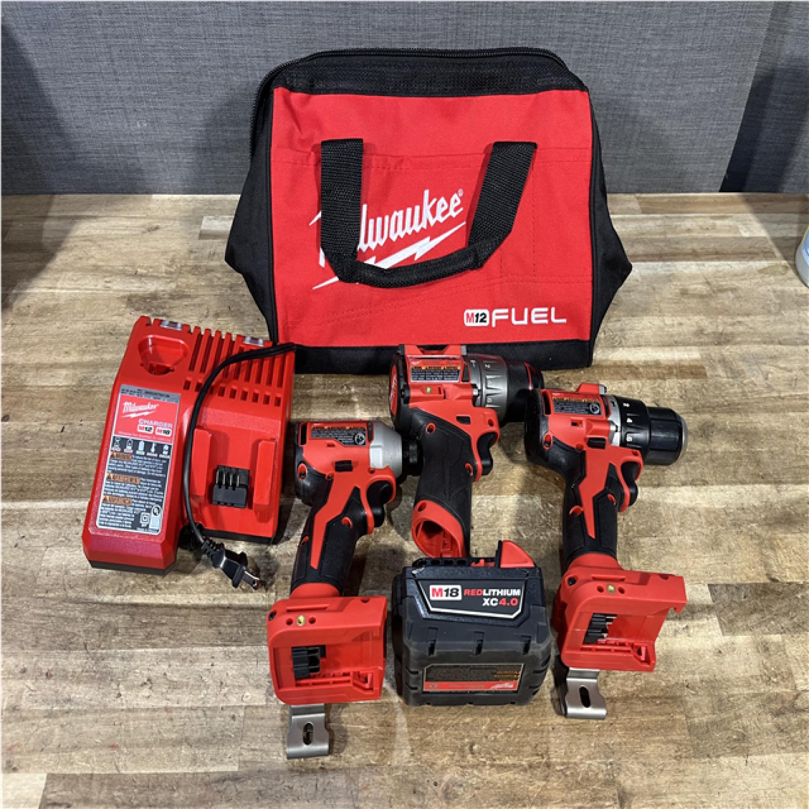 Houston Location AS-IS Milwaukee Drill Driver Hammers QTY/2 and Impact Driver and Battery with Charger