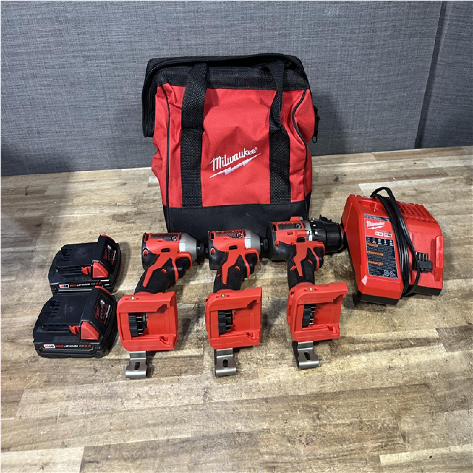 Houston Location AS-IS Milwaukee Drill Driver and Impact Drivers QTY/2 and Batteries QTY/2 with Charger