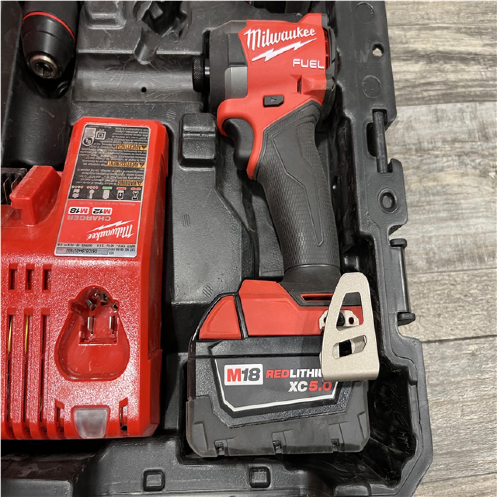 AS-IS Milwaukee FUEL 18V Lithium-Ion Brushless Cordless Hammer Drill and Impact Driver Combo Kit