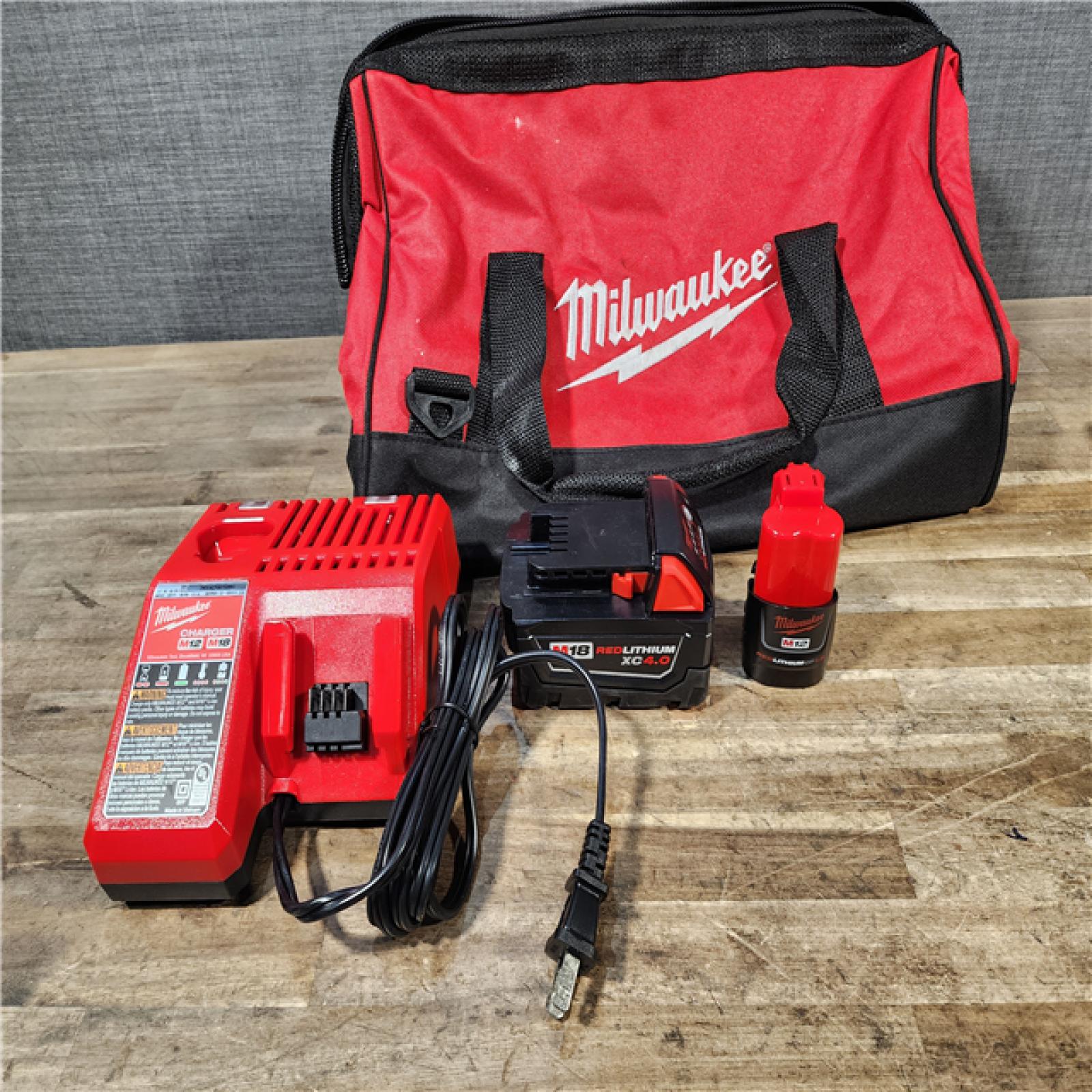 HOUSTON LOCATION - AS-IS Milwaukee 12/18V Lithium-Ion Cordless 3/8 in. Ratchet and 1/2 in. High Torque Impact Wrench with Friction Ring Combo Kit