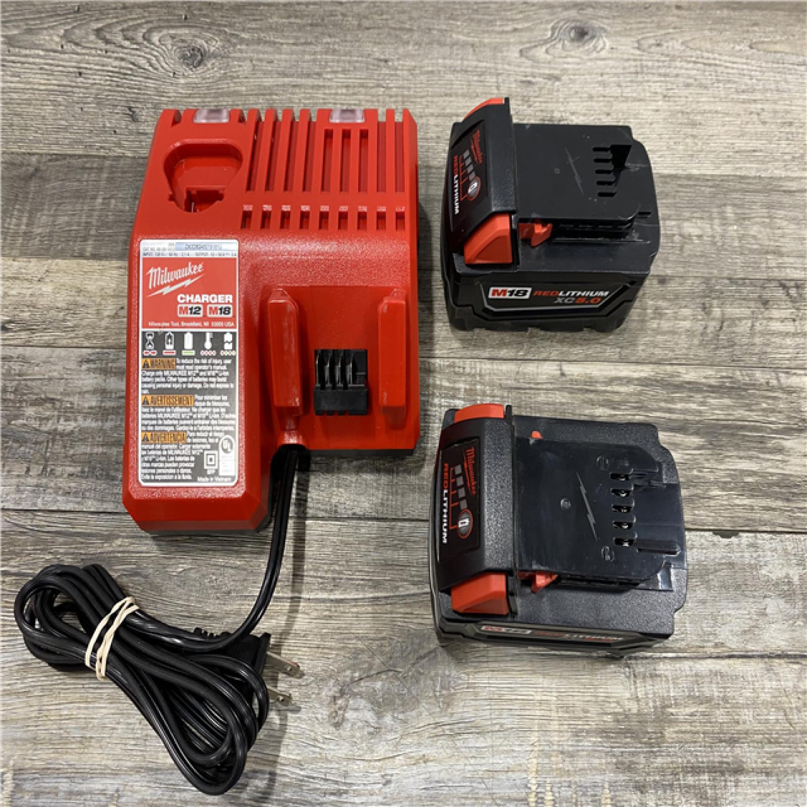 AS-IS Milwaukee 18-Volt Lithium-Ion XC Starter Kit with Two 5.0Ah Batteries and Charger