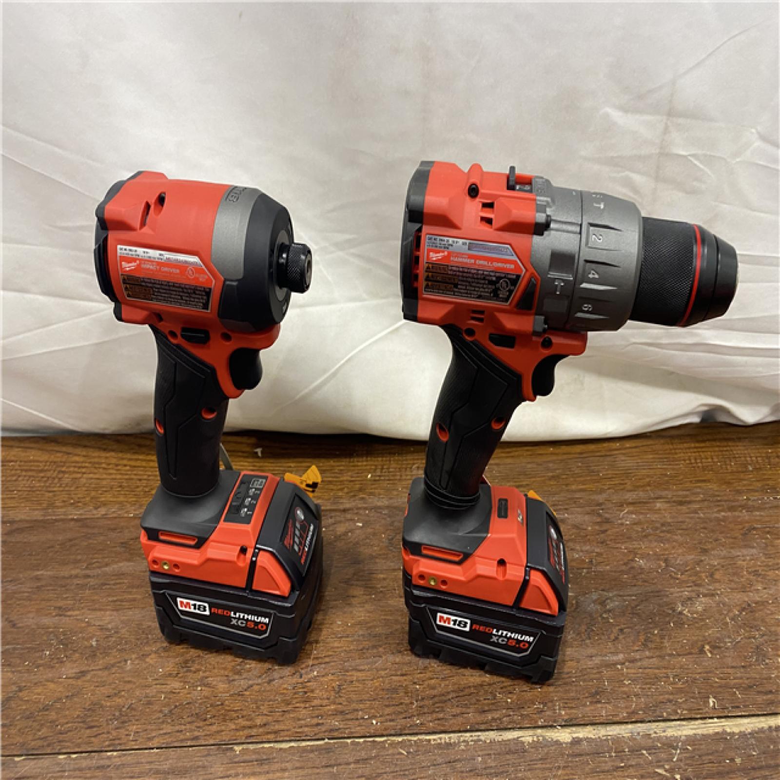 AS-IS MILWAUKEE M18 FUEL 18V Lithium-Ion Brushless Cordless Hammer Drill and Impact Driver Combo Kit (2-Tool) with 2 Batteries