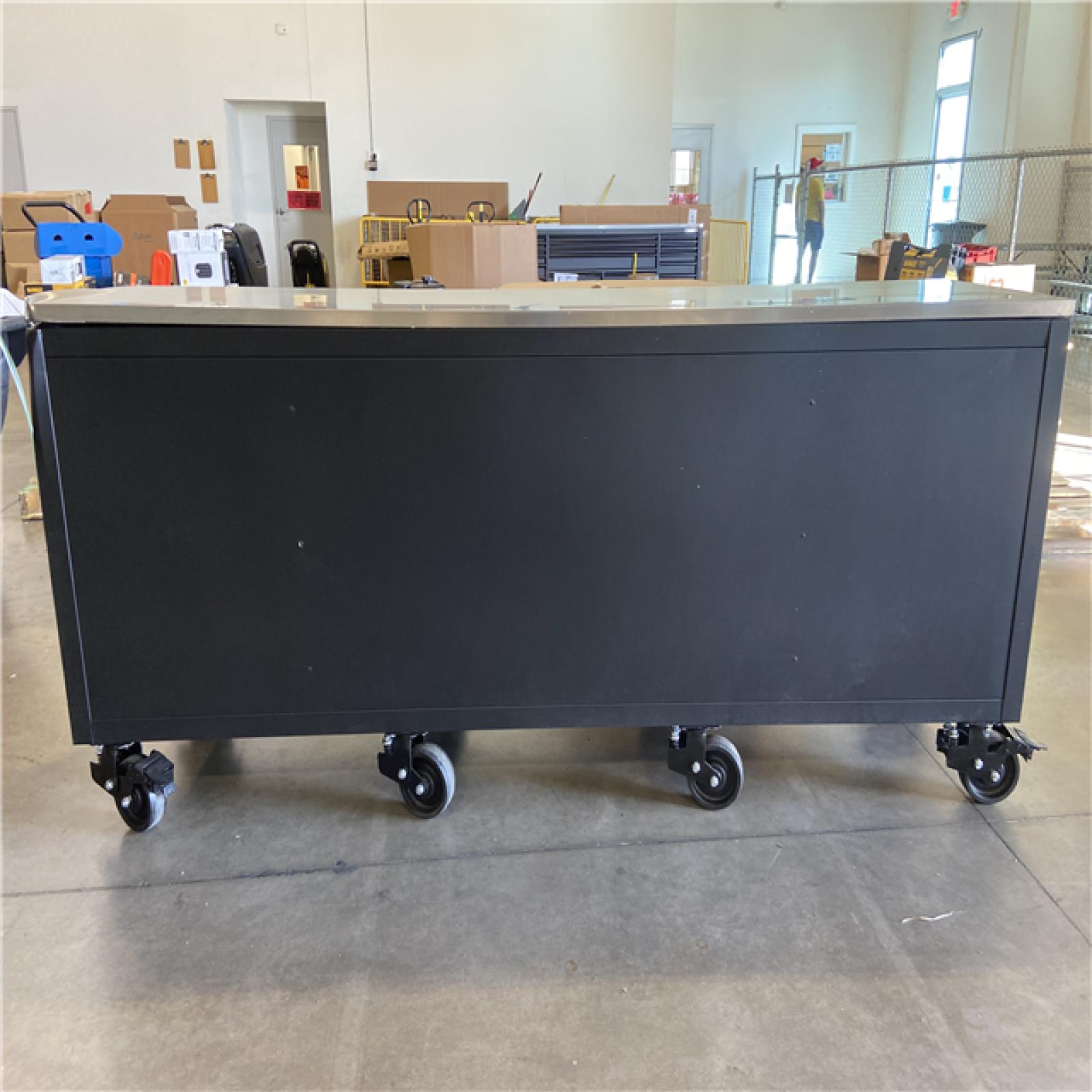 DALLAS LOCATION - Husky 96 in. W x 24 in. D 16-Drawer Heavy-Duty Mobile Workbench with Stainless Steel Top in Matte Black