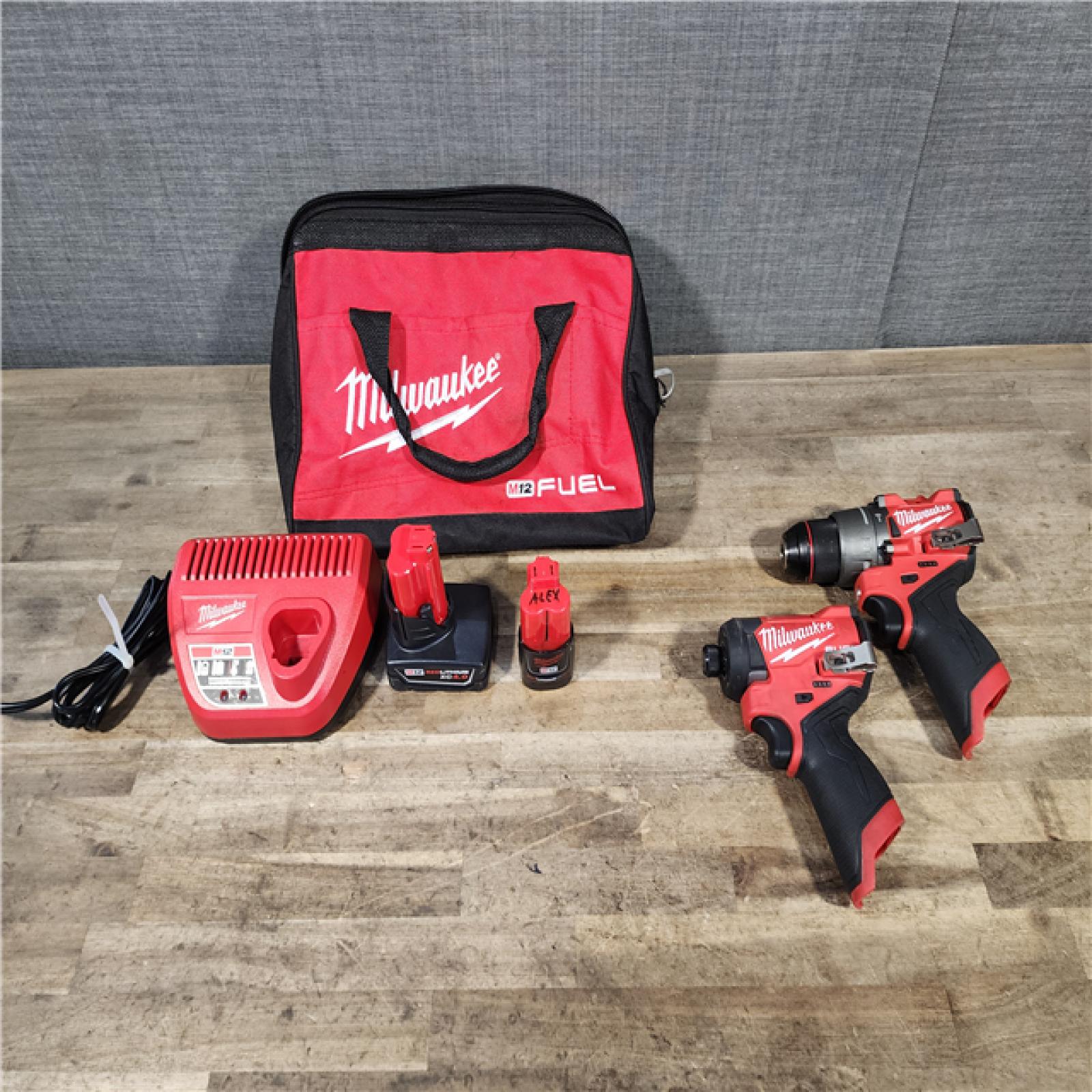 HOUSTON LOCATION - AS-IS Milwaukee FUEL 12-Volt Lithium-Ion Brushless Cordless Hammer Drill and Impact Driver Combo Kit