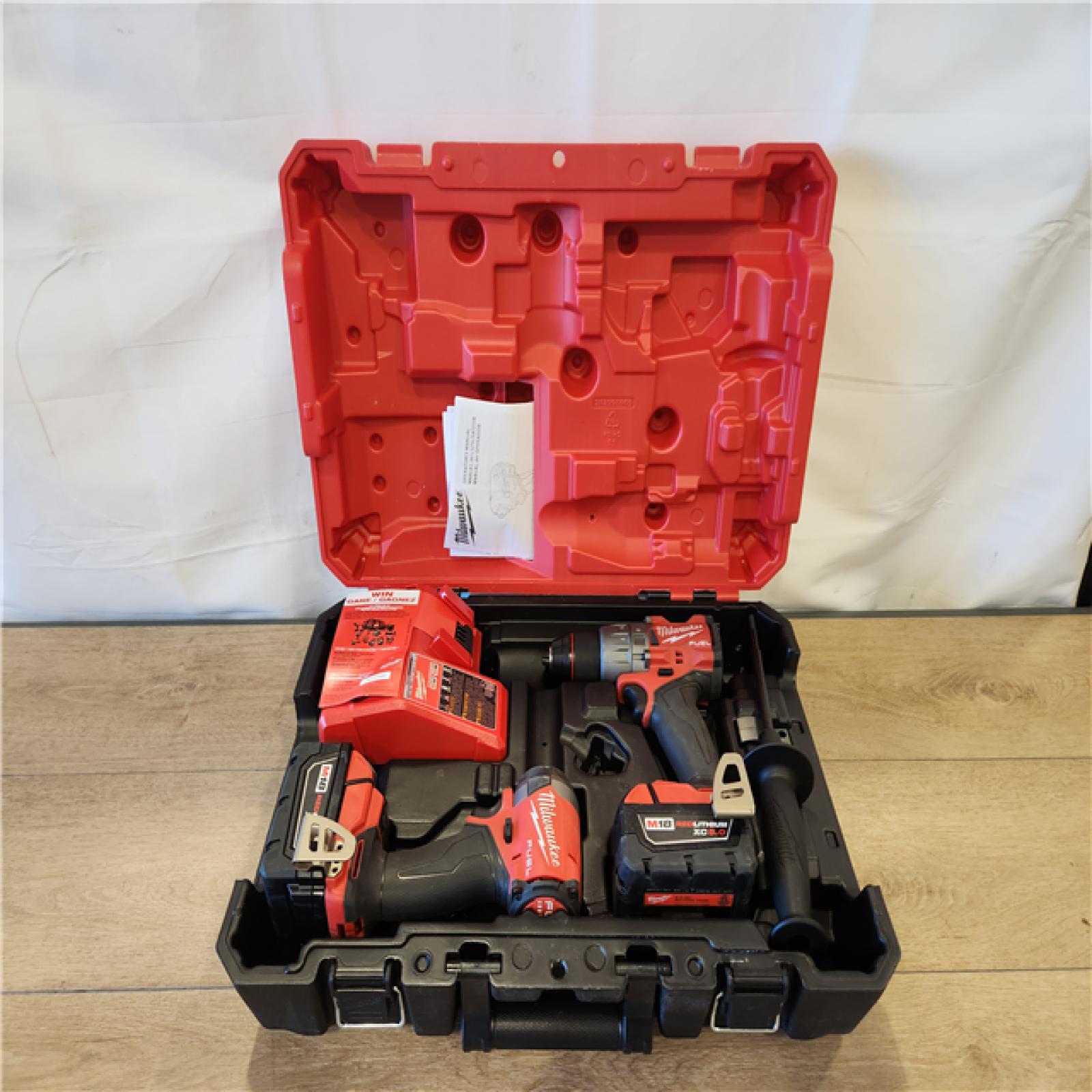 AS-IS- Milwaukee FUEL 18V Lithium-Ion Brushless Cordless Hammer Drill and Impact Driver Combo Kit