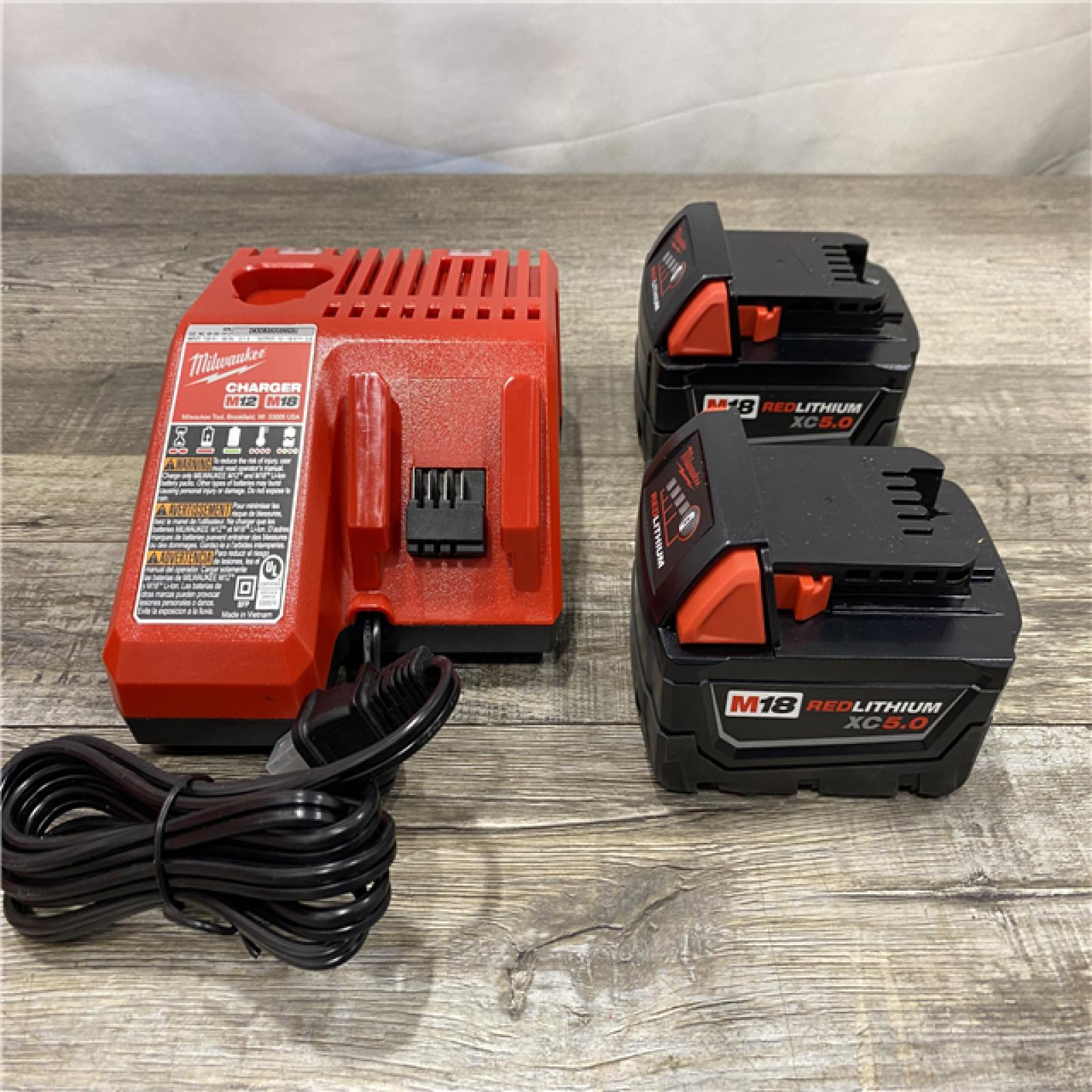 AS-IS Milwaukee 18-Volt Lithium-Ion XC Starter Kit with Two 5.0Ah Batteries and Charger