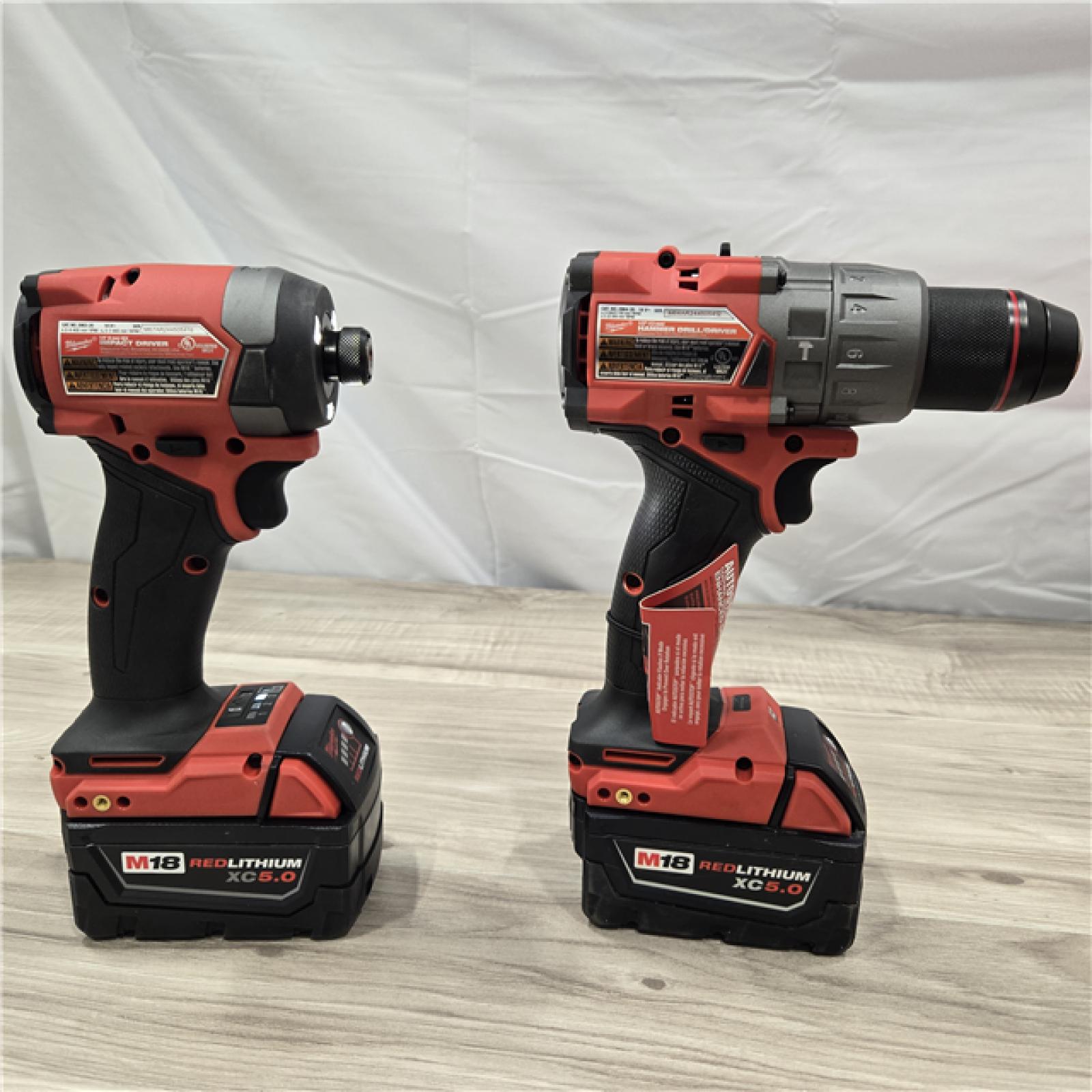 AS-IS MILWAUKEE FUEL 18V Lithium-Ion Brushless Cordless Hammer Drill and Impact Driver Combo Kit (2-Tool) with 2 Batteries