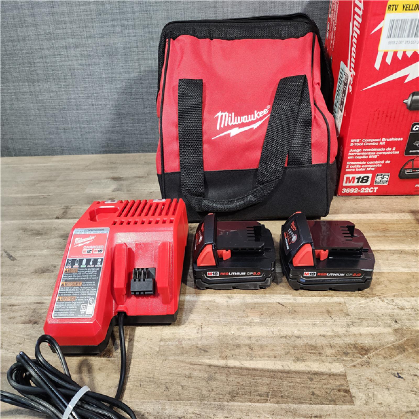 HOUSTON LOCATION - AS-IS Milwaukee M18 18V Lithium-Ion Brushless Cordless Compact Drill/Impact Combo Kit (2-Tool) W/(2) 2.0 Ah Batteries  Charger & Bag