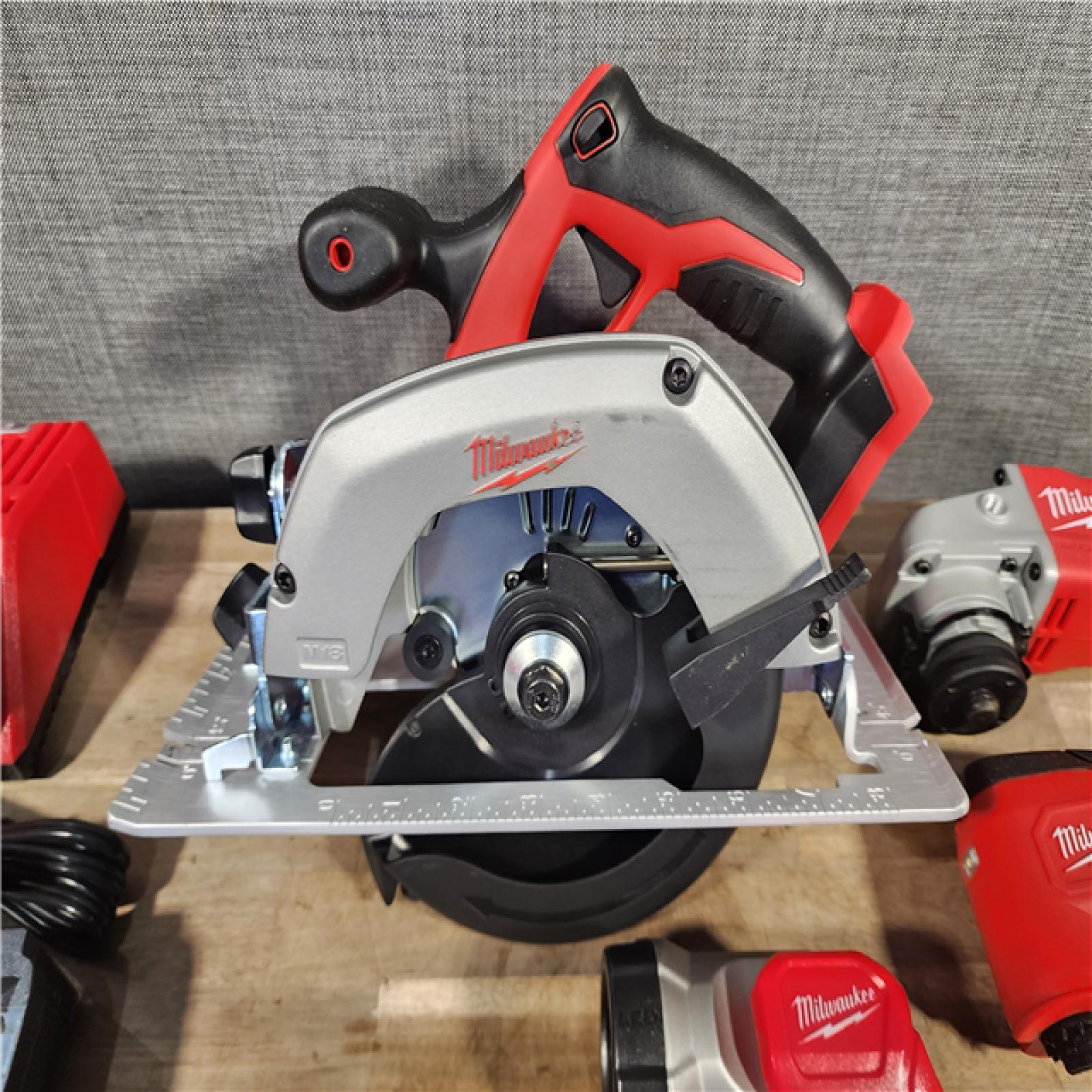 HOUSTON LOCATION - AS-IS Milwaukee M18 18-Volt Lithium-Ion Cordless Combo Kit 7-Tool with 2-Batteries, Charger and Tool Bag