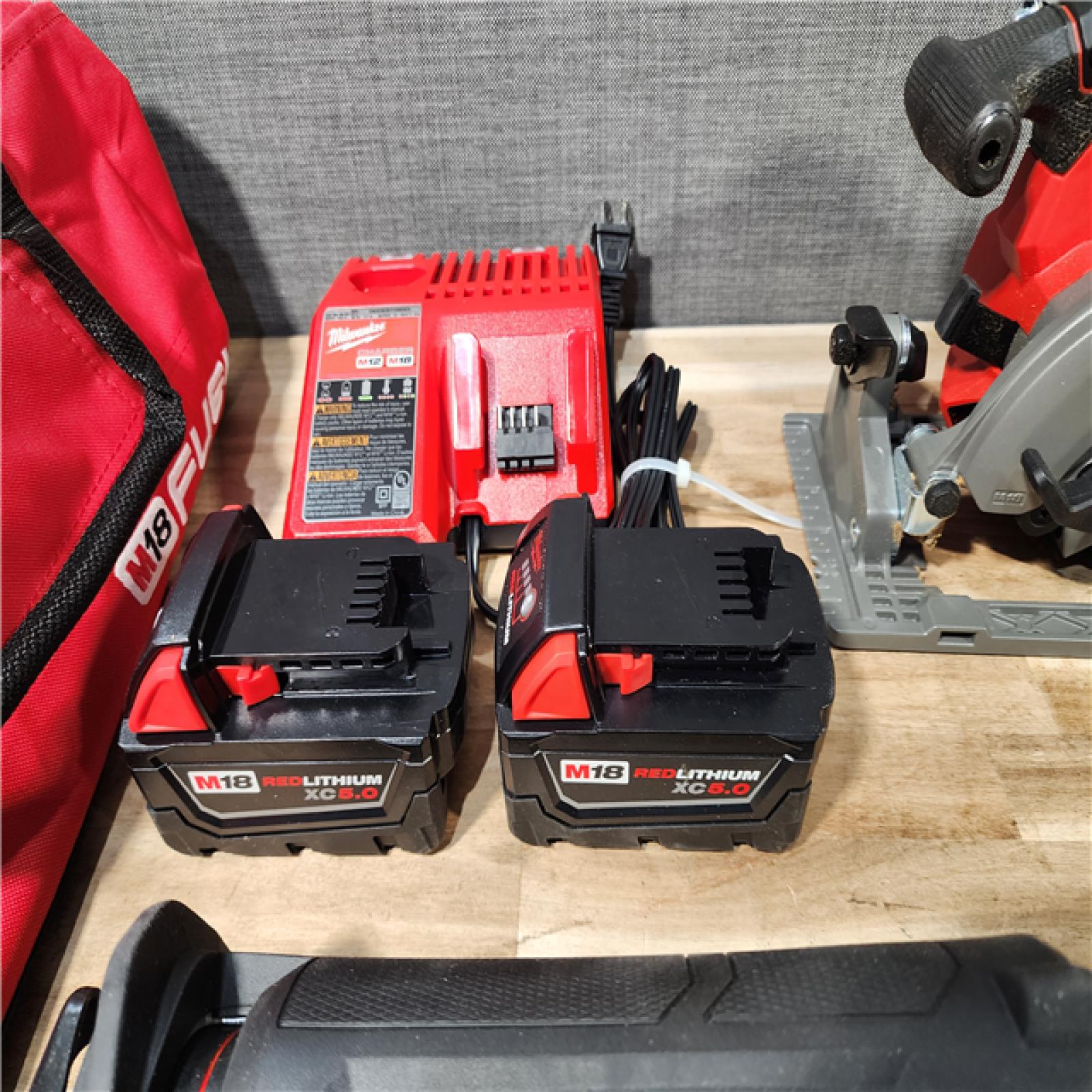 HOUSTON LOCATION - AS-IS (APPEARS LIKE NEW) Milwaukee M18 FUEL 18V Lithium-Ion Brushless Cordless 5-Tool Combo Kit with Two 5.0 Ah Batteries  1 Charger 1 Tool Bag