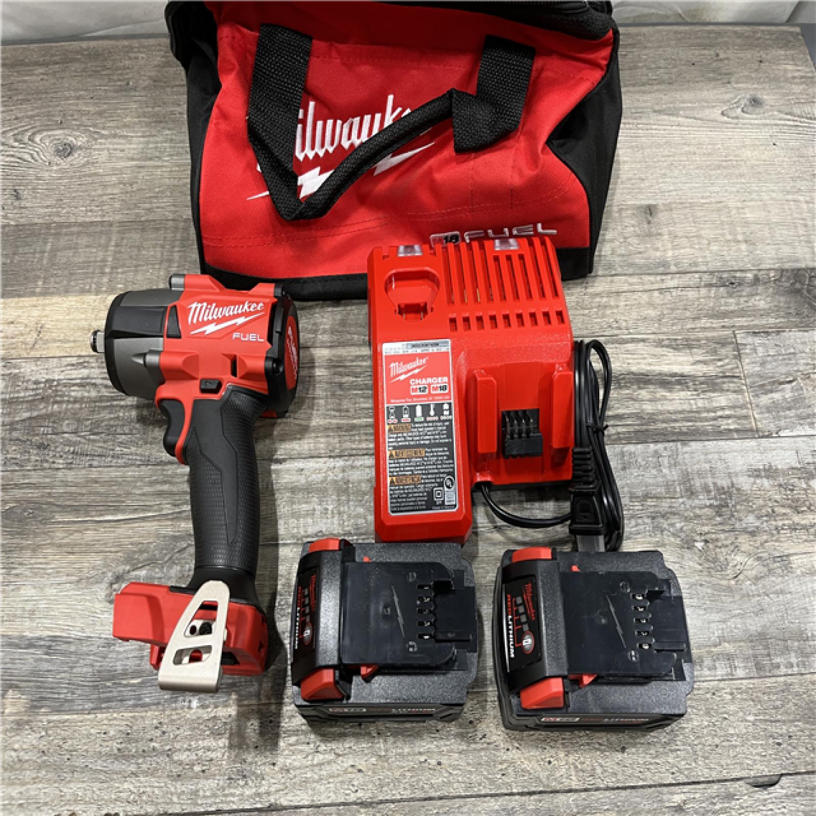 AS-IS Milwaukee FUEL 18V Lithium-Ion Brushless Cordless 1/2 in. Mid-Torque Impact Wrench with Friction Ring Kit