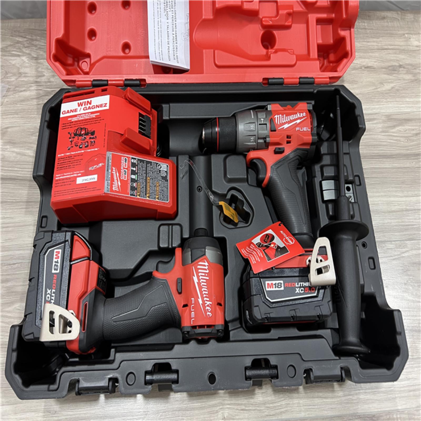 AS-IS Milwaukee FUEL 18V Lithium-Ion Brushless Cordless Hammer Drill and Impact Driver Combo Kit