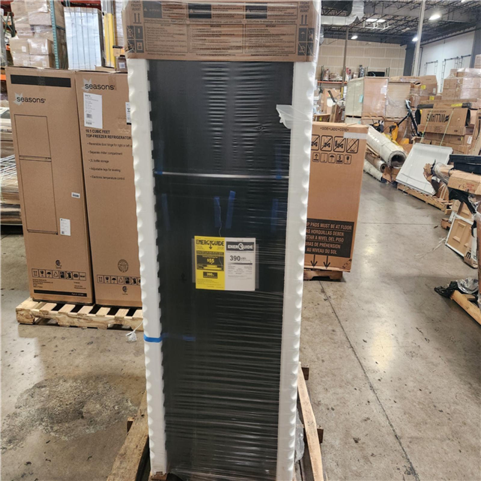 Phoenix Location NEW Whirlpool 16.6 cu. ft. Built-In Top Freezer Refrigerator in Black