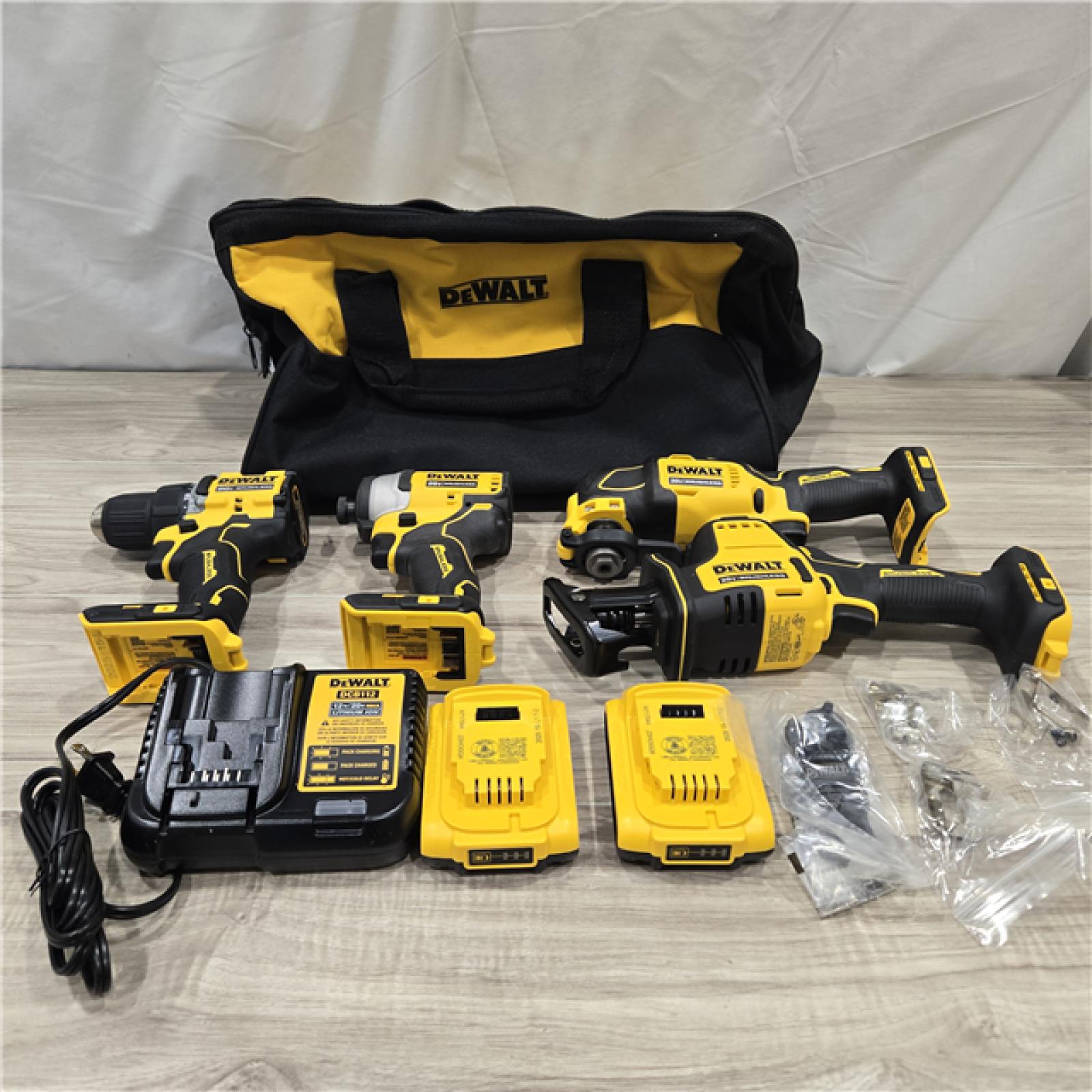 AS-IS DeWalt 20V MAX ATOMIC Cordless Brushless 4-Tool Combo Kit