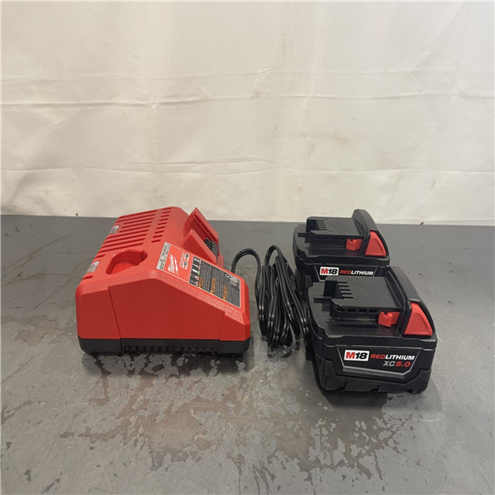 AS-IS- Milwaukee M18 18-Volt Lithium-Ion XC Starter Kit with Two 5.0Ah Batteries and Charger