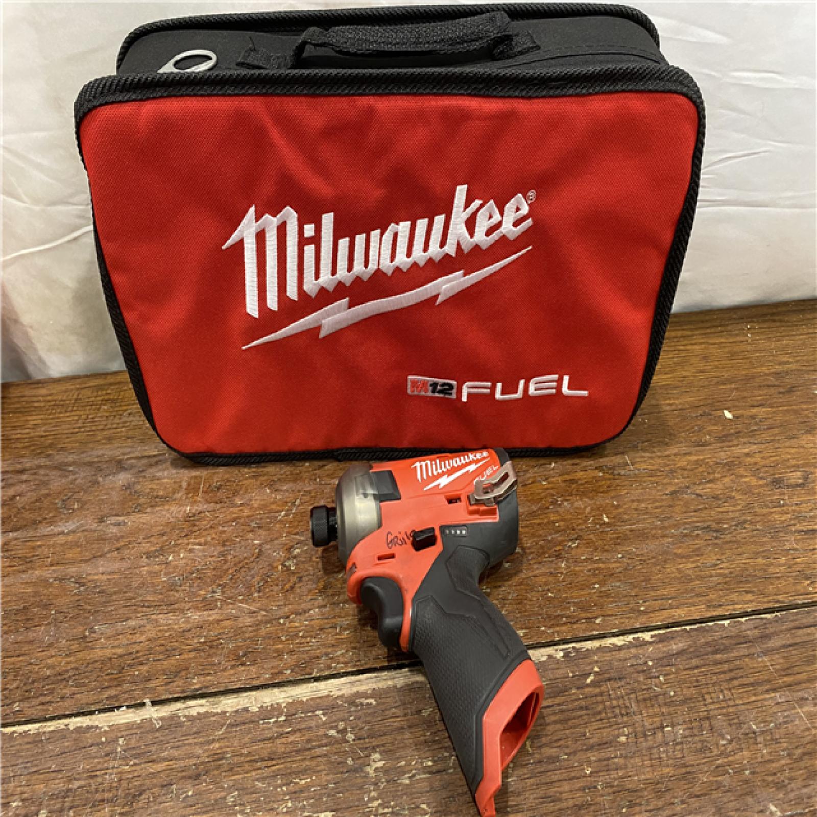 AS-IS M12 FUEL SURGE 12V Lithium-Ion Brushless Cordless 1/4 in. Hex Impact Driver Compact Kit W/Two 2.0Ah Batteries, Bag