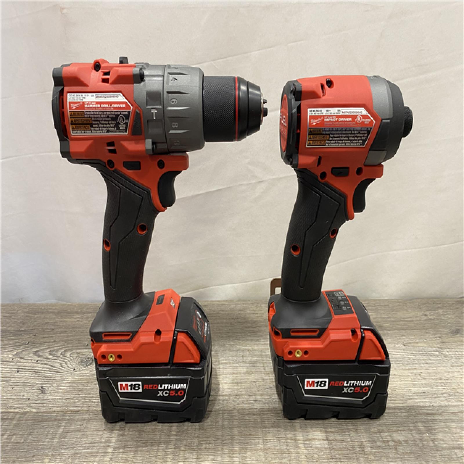 AS-IS Milwaukee FUEL 18V Lithium-Ion Brushless Cordless Hammer Drill and Impact Driver Combo Kit