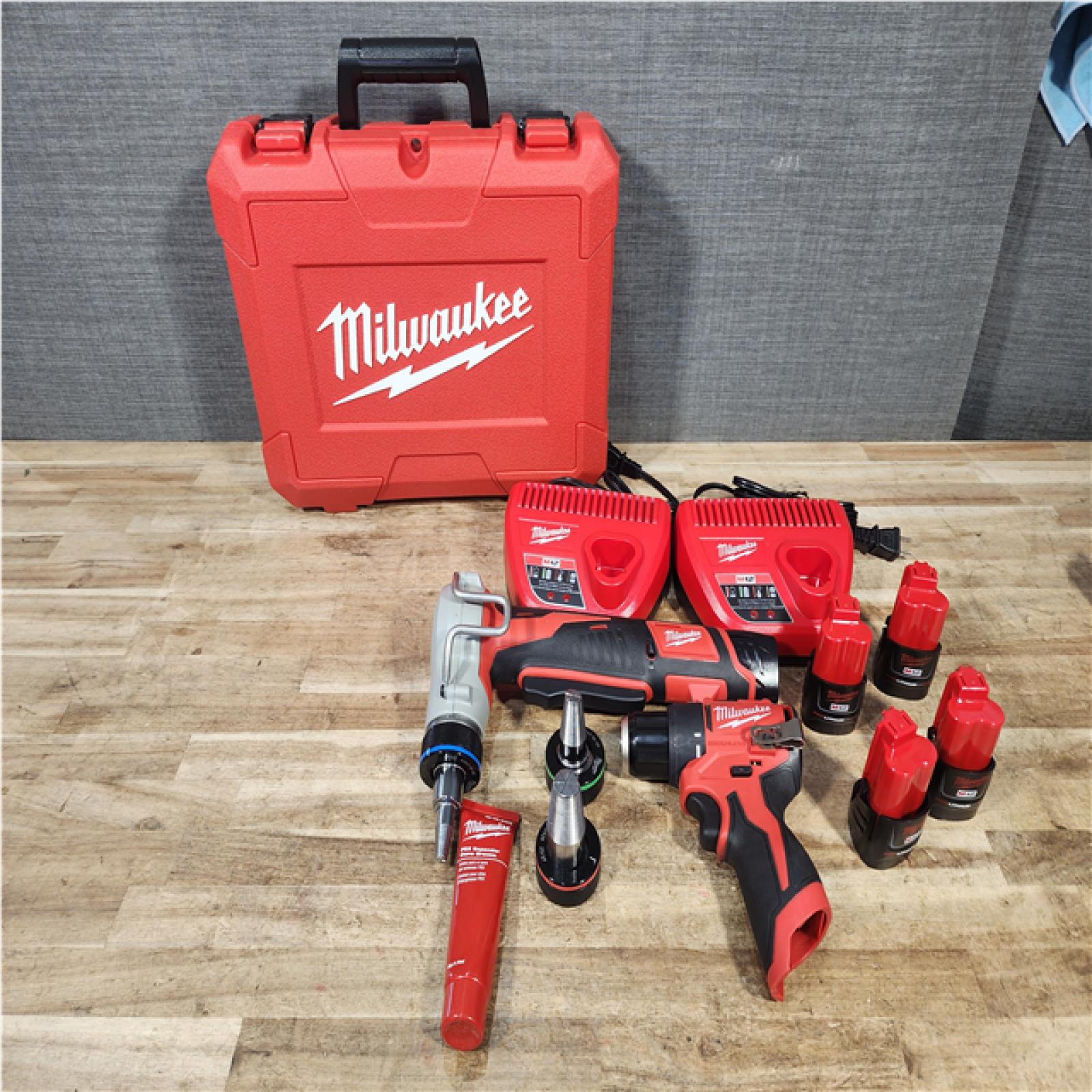 Houston Location AS-IS Milwaukee Drill and Expander and Batteries QTY/4 and Chargers QTY/2