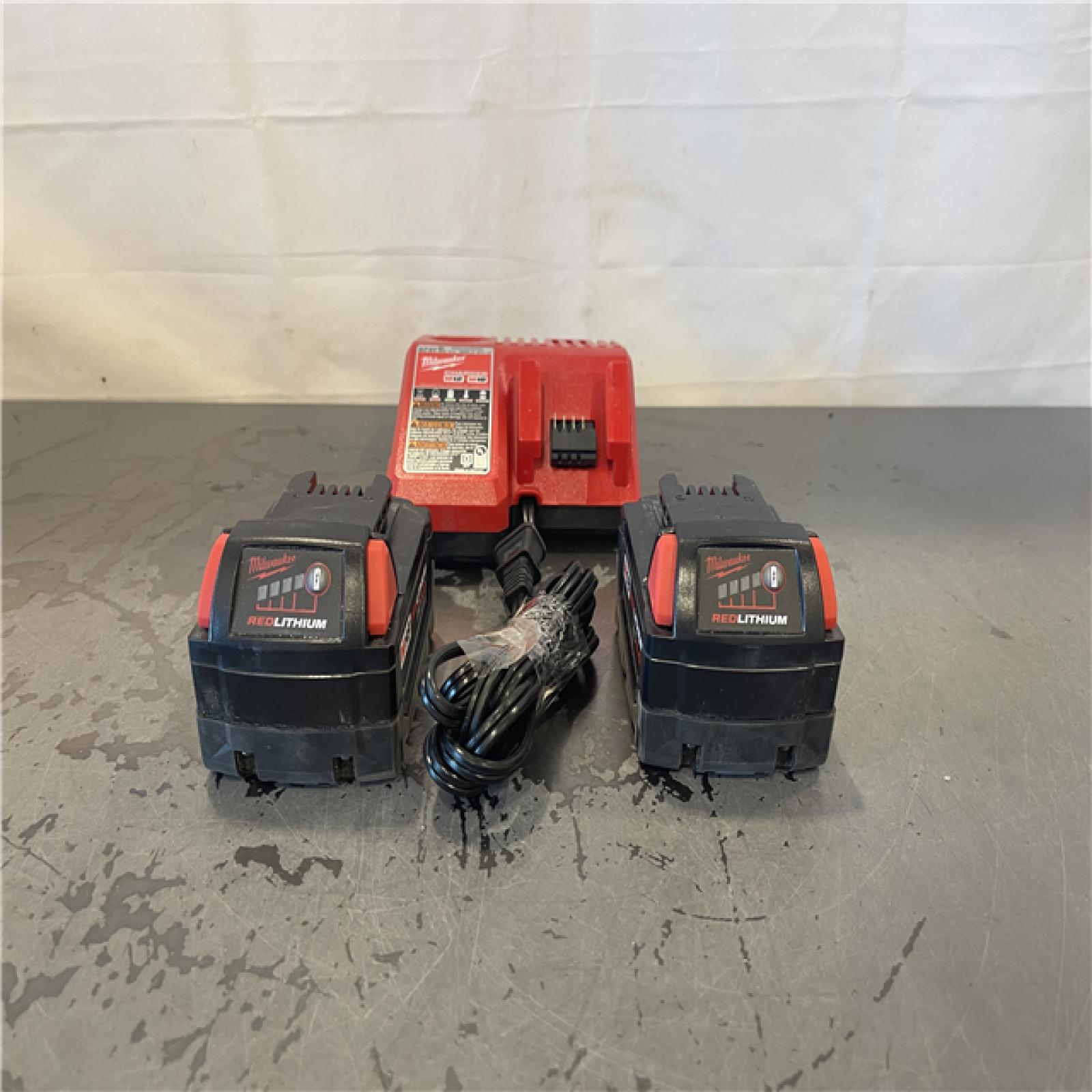 AS-IS- Milwaukee M18 18-Volt Lithium-Ion XC Starter Kit with Two 5.0Ah Batteries and Charger
