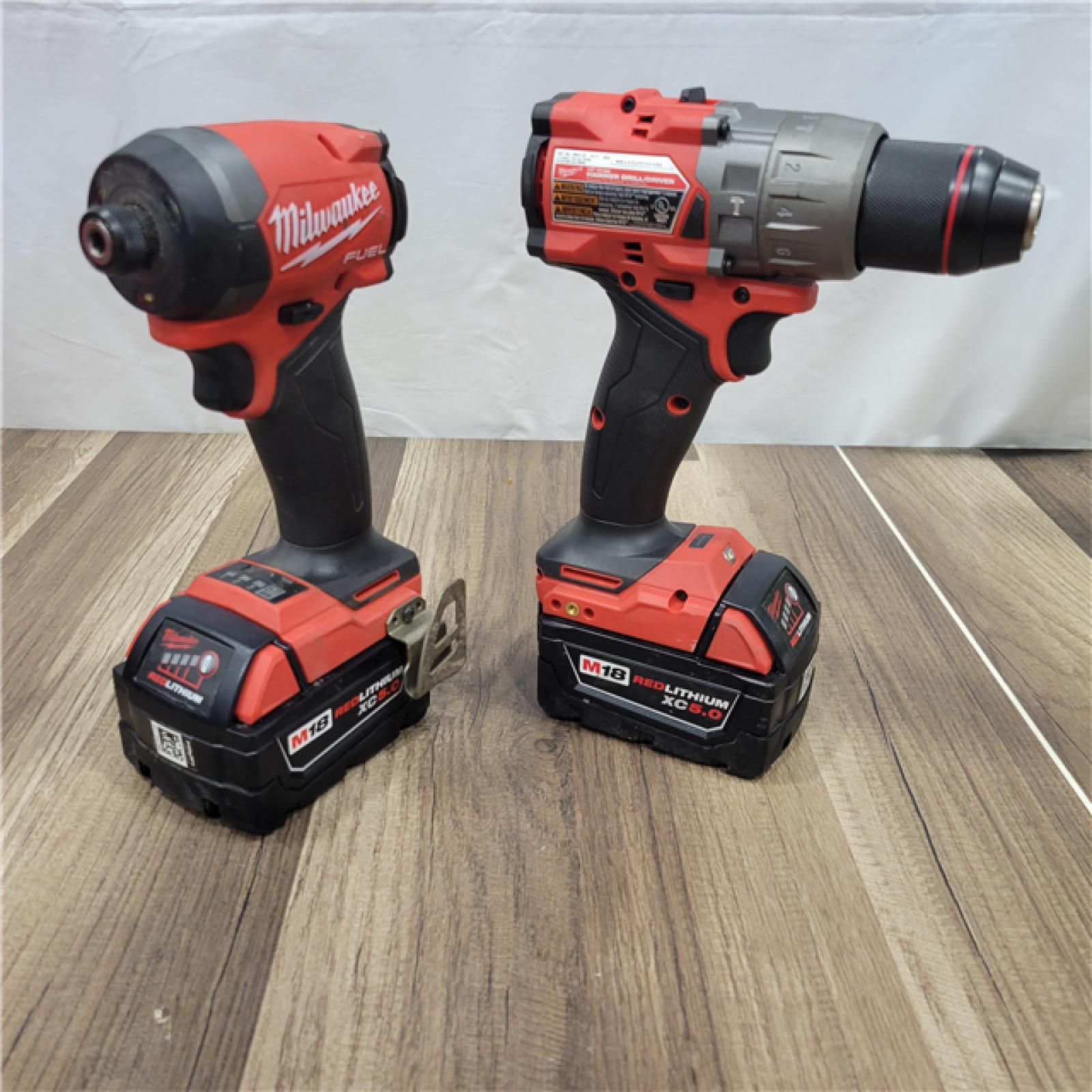 AS-IS MILWAUKEE M18 FUEL 18V Lithium-Ion Brushless Cordless Hammer Drill and Impact Driver Combo Kit (2-Tool) with 2 Batteries