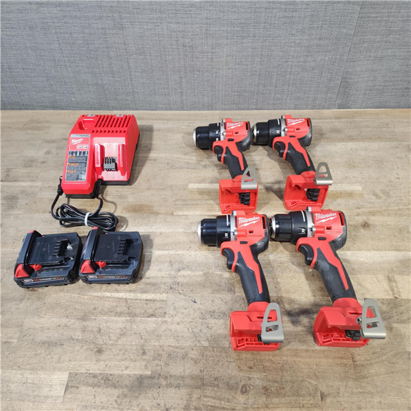 HOUSTON LOCATION - AS-IS MILWAUKEE 4 TOOL COMBO KIT W/ (2) BATTERY & CHARGER
