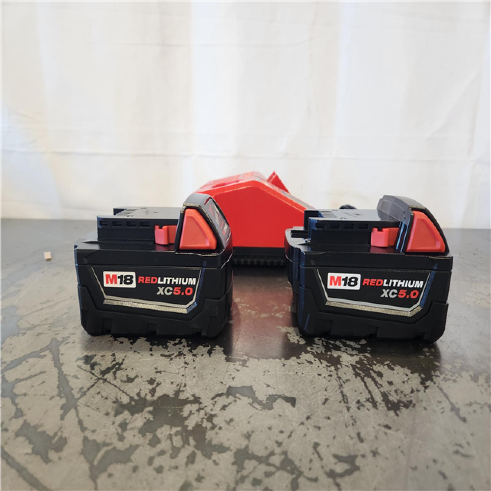 AS-IS- Milwaukee 18-Volt Lithium-Ion XC Starter Kit with Two 5.0Ah Batteries and Charger