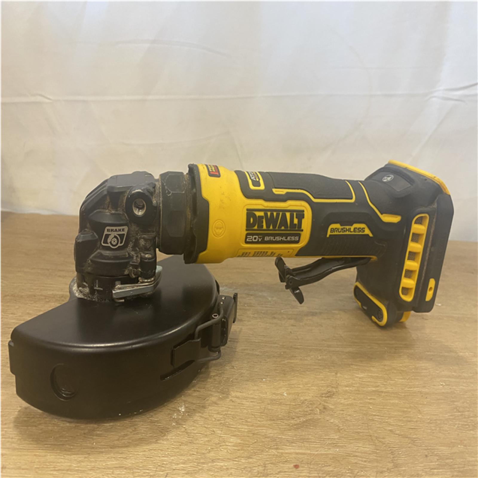 AS-IS DEWALT ATOMIC 20V MAX Cordless 4-1/2 in. Angle Grinder with Paddle Switch (Tool Only)