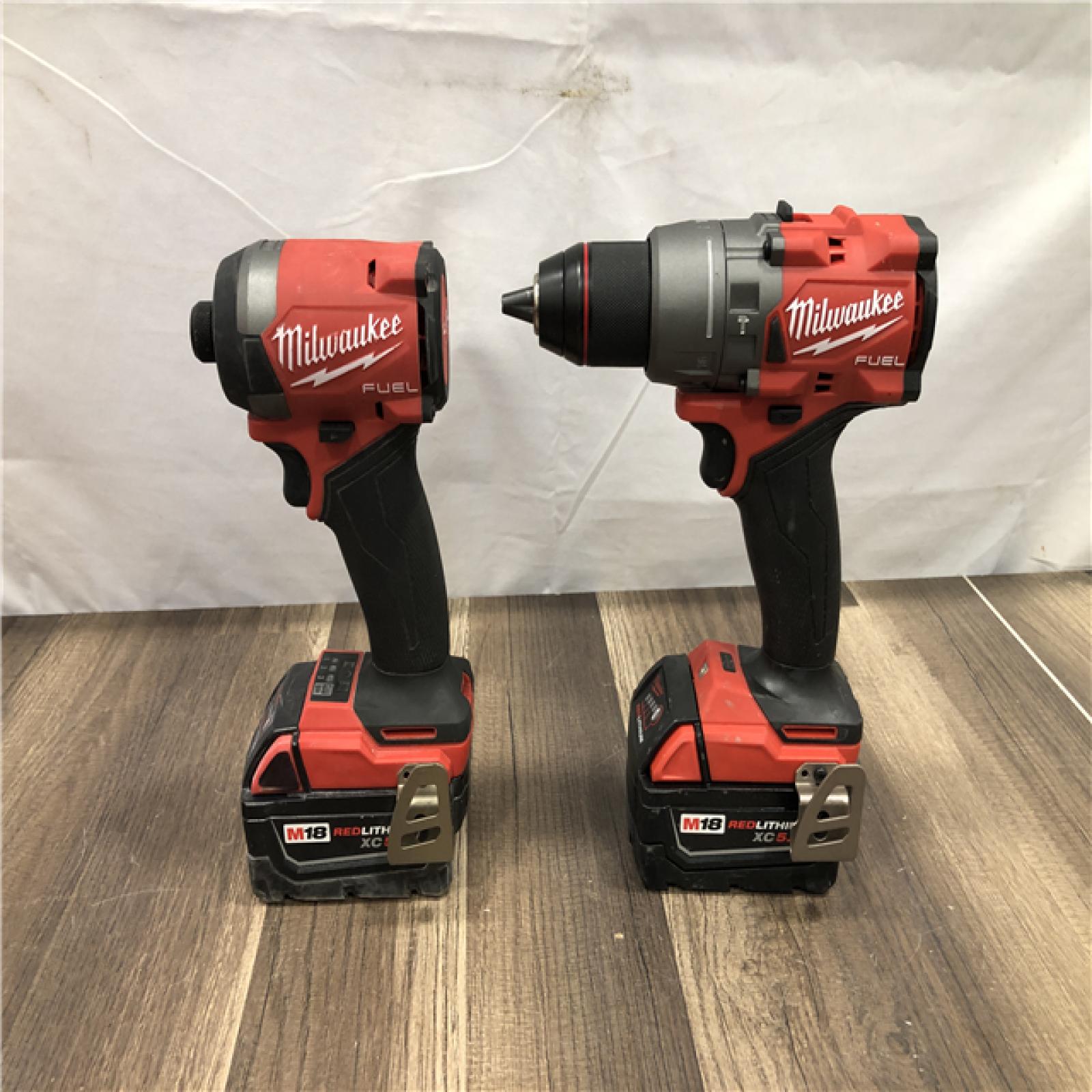 AS-IS Milwaukee FUEL 18V Lithium-Ion Brushless Cordless Hammer Drill and Impact Driver Combo Kit